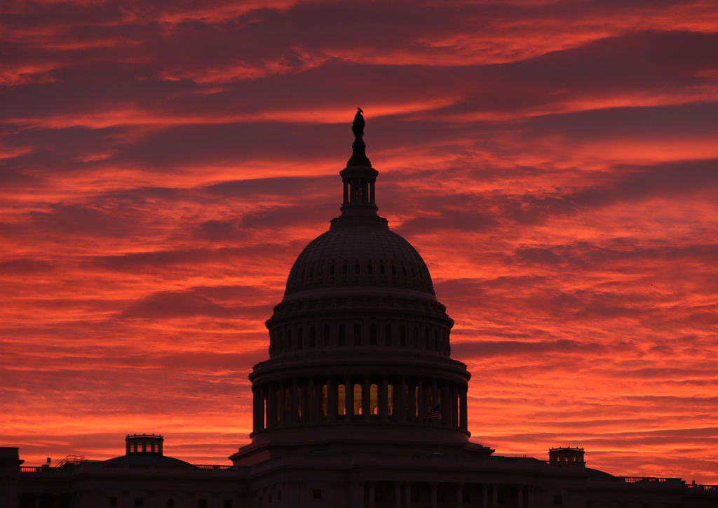The sky turns to a fiery color as the sun begins to rise behind the U.S. Capitol building, on November 7, 2019 in Washington, D.C. (Mark Wilson&mdash;Getty Images)