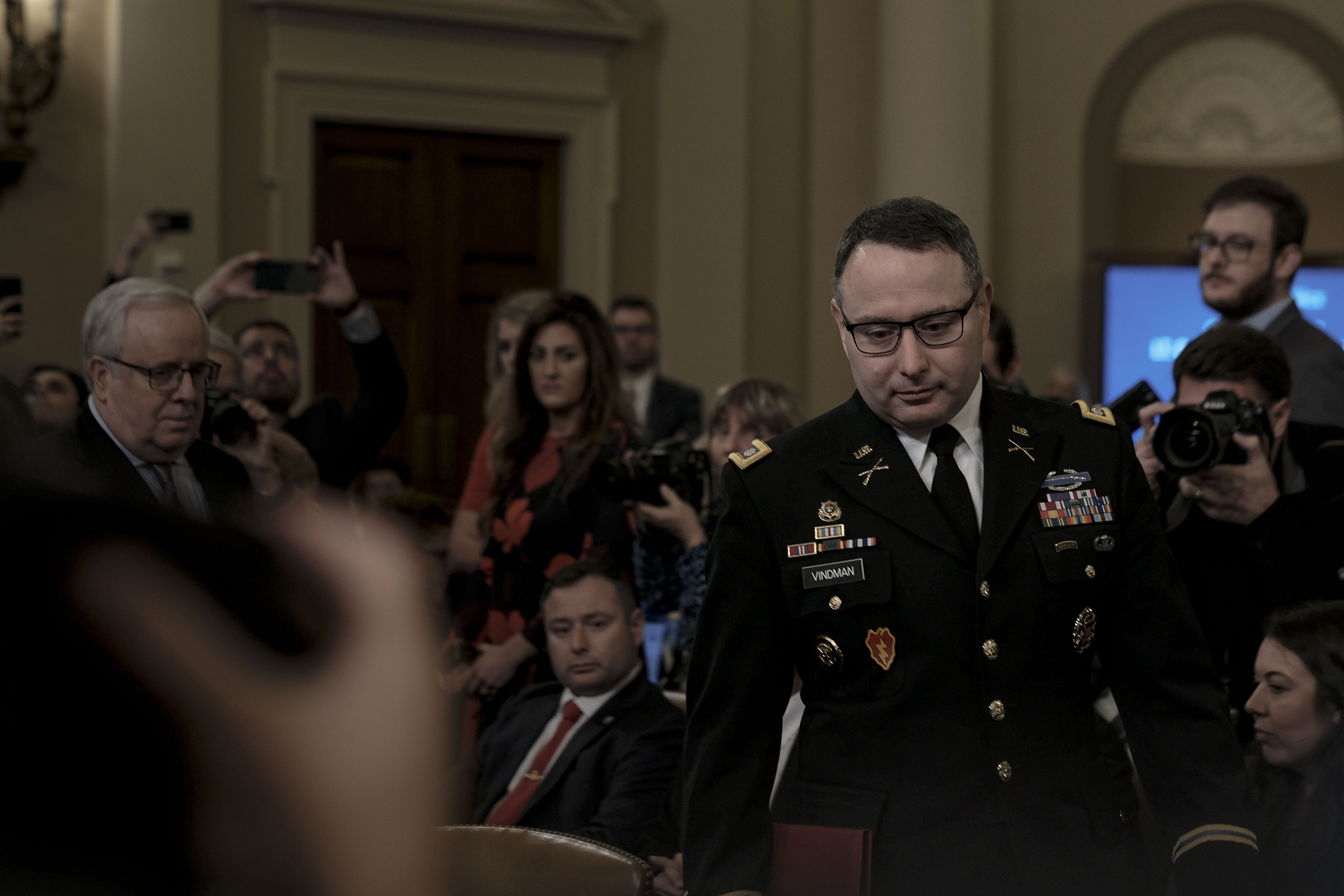 Witness Lt. Col. Alexander Vindeman, National Security Council staffer, enters the House Intelligence Committee hearing on the impeachment inquiry on Capitol Hill in Washington, D.C. on Nov. 19, 2019. Gabriella Demczuk / TIME (Gabriella Demczuk for TIME)