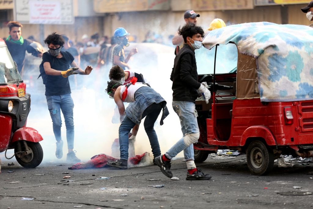 Demonstrators clash with Iraqi security forces during the ongoing anti-government protests in Baghdad on Nov. 12, 2019. (Anadolu Agency—Getty Images)