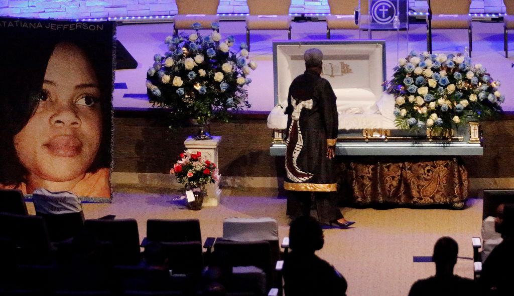 A mourner pays respects before the start of the funeral service for Atatiana Jefferson on Oct. 24, 2019, at Concord Church in Dallas, Texas. (Stewart F. House&mdash;Getty Images)