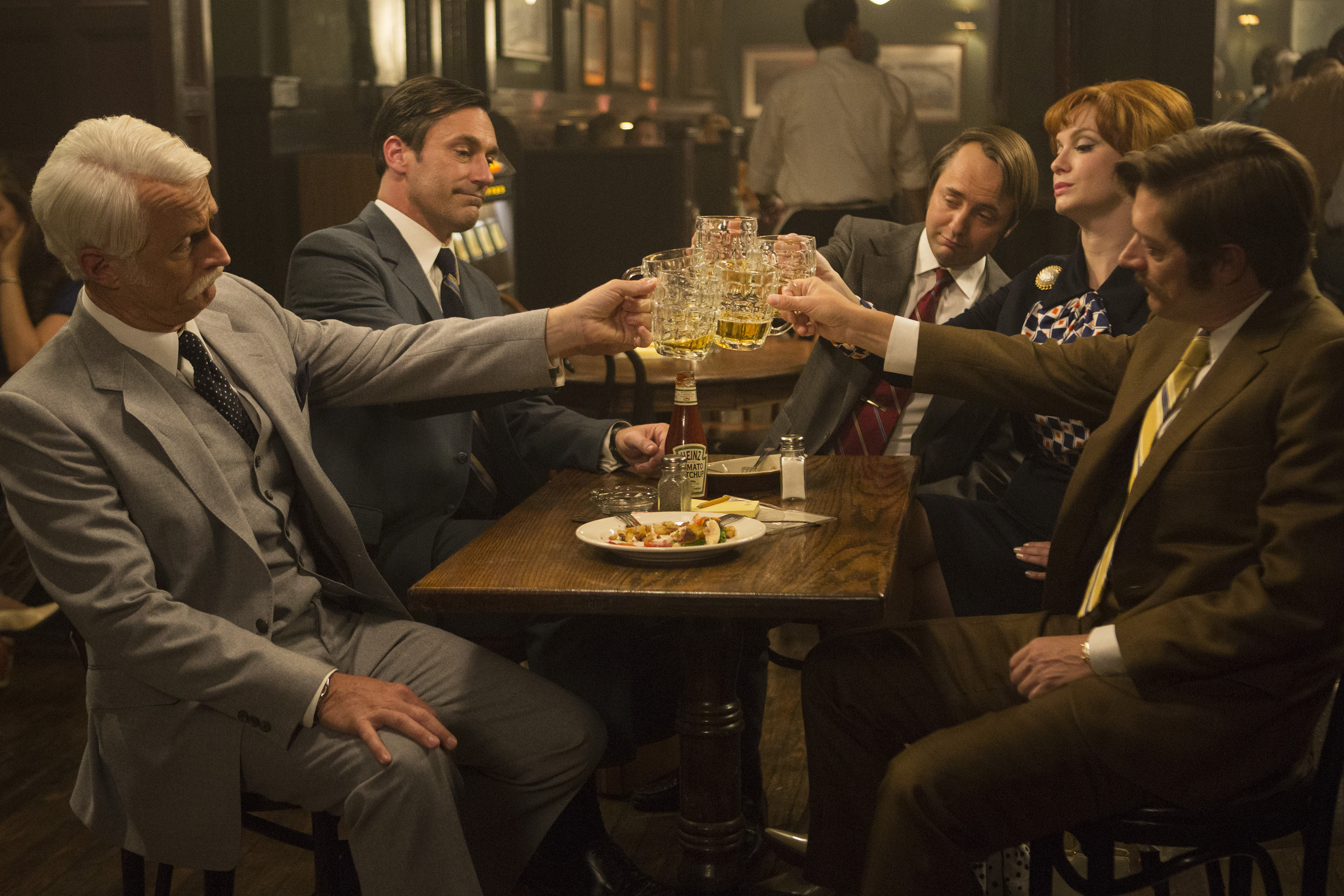 John Slattery as Roger Sterling, Jon Hamm as Don Draper, Vincent Kartheiser as Pete Campbell, Christina Hendricks as Joan Harris and Kevin Rahm as Ted Chaough in Mad Men. (Justina Mintz—AMC Networks)