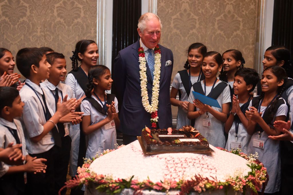 U.K.'s Prince Charles shared a birthday cake with schoolchildren in Mumbai on Nov. 14, 2019. (STR—AFP/Getty Images)