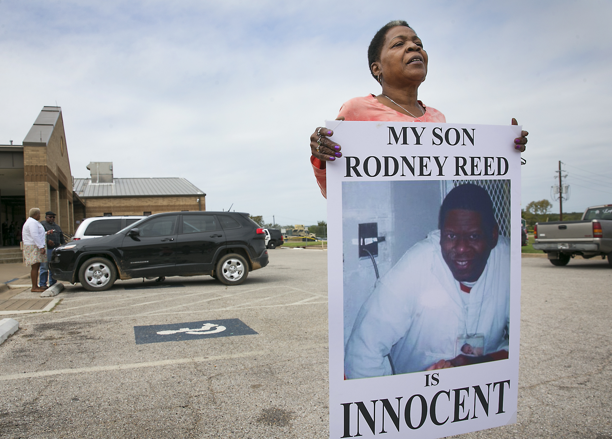 Sandra Reed, the mother of death row inmate Rodney Reed, shows her continued support of her son by carrying this placard around the parking lot during a break in a hearing in Bastrop County District Court on Tuesday, October 10. 2017. (Ralph Barrera—AP)