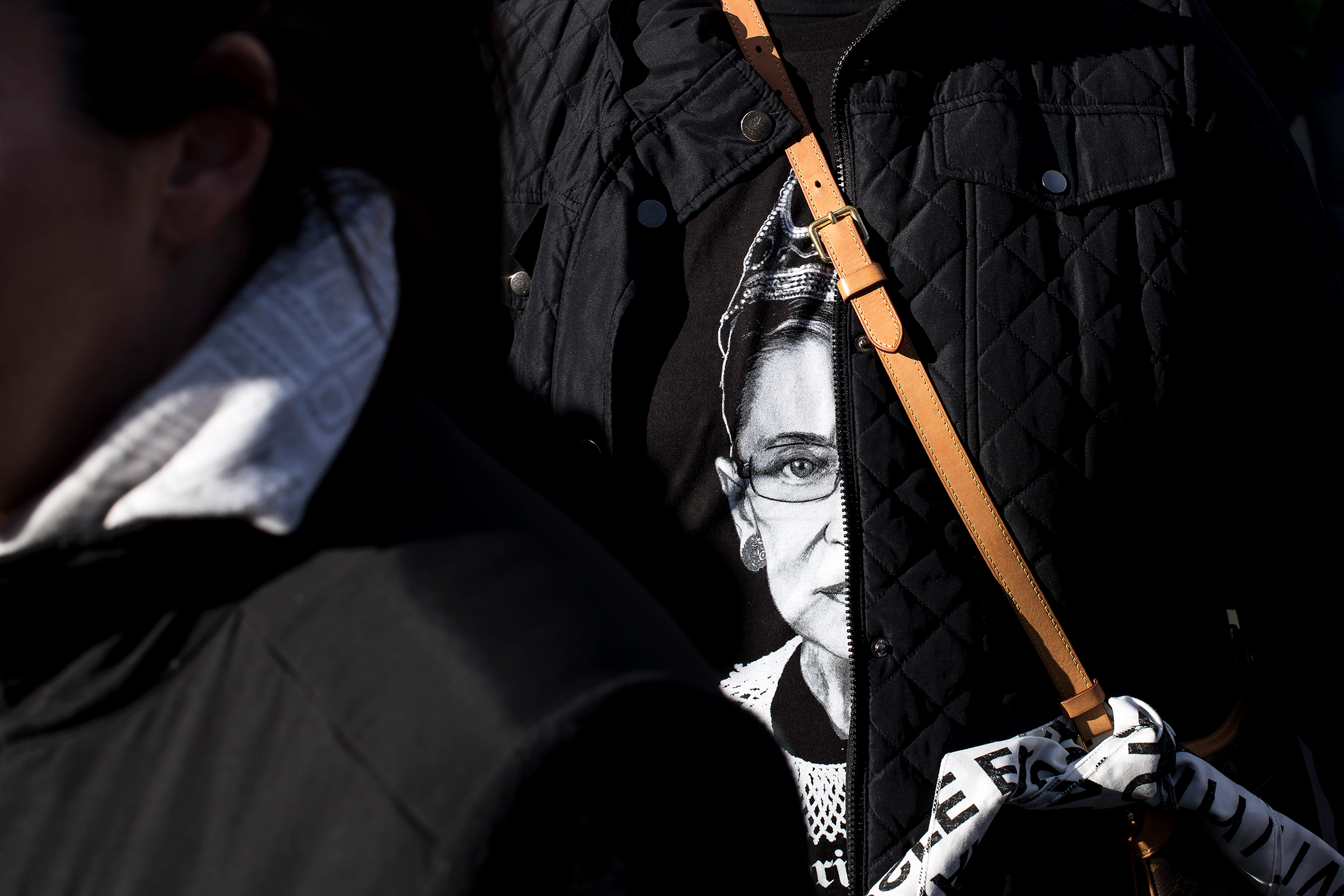 A woman attending the New York City Women's March wears a t-shirt ​featuring Supreme Court Justic​e Ruth Bader Ginsburg on Jan. 20, 2018.