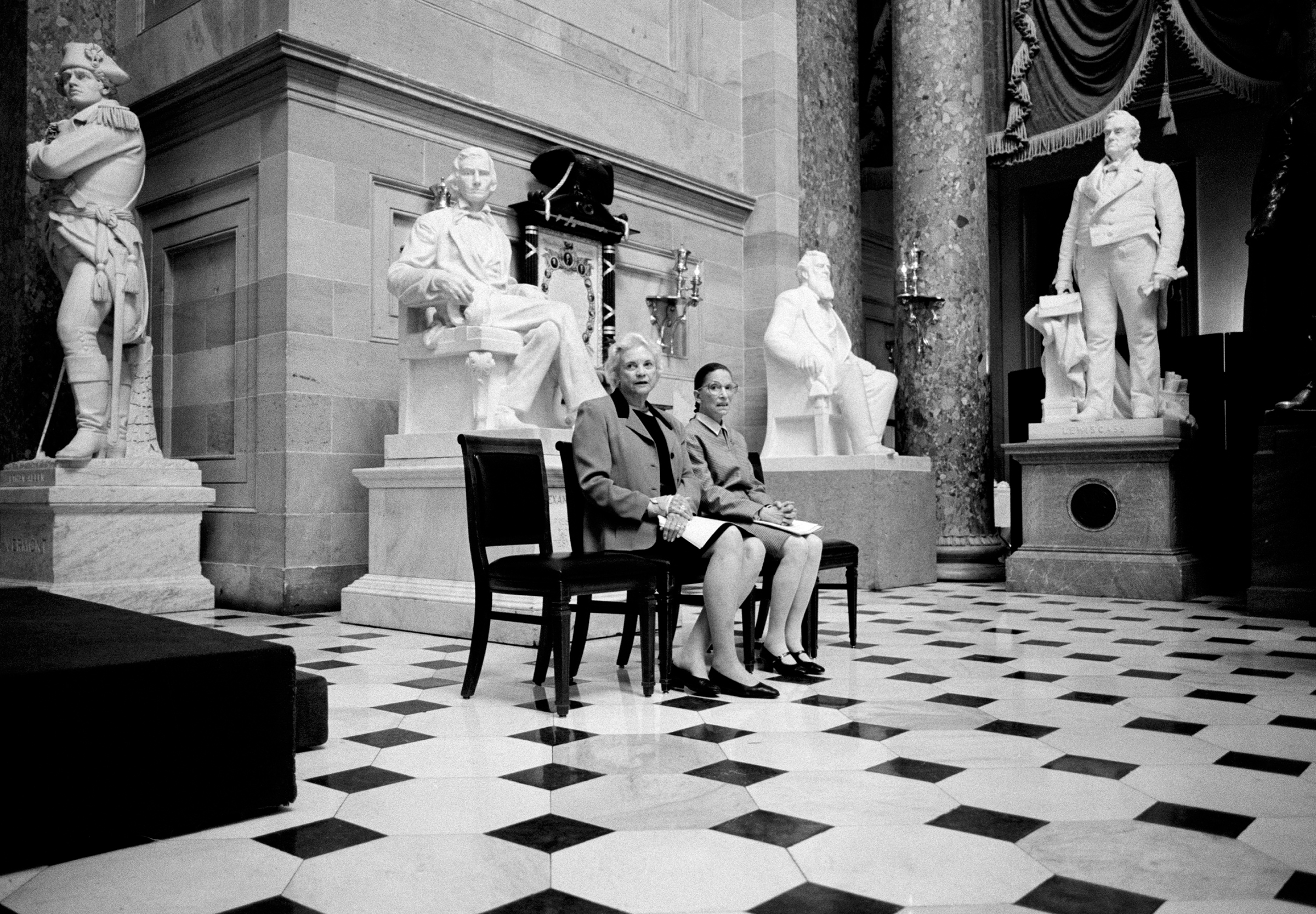 March 2001 The only two female Justices of the U.S. Supreme Court, Sandra Day O'Connor and Ruth Bader Ginsburg, pose for a portrait in Statuary Hall, surrounded by statues of men at the U.S. Capitol Building in Washington, D.C. The two Justices were preparing to address a meeting of the Congressional Women's Caucus. (David Hume Kennerly—Getty Images)