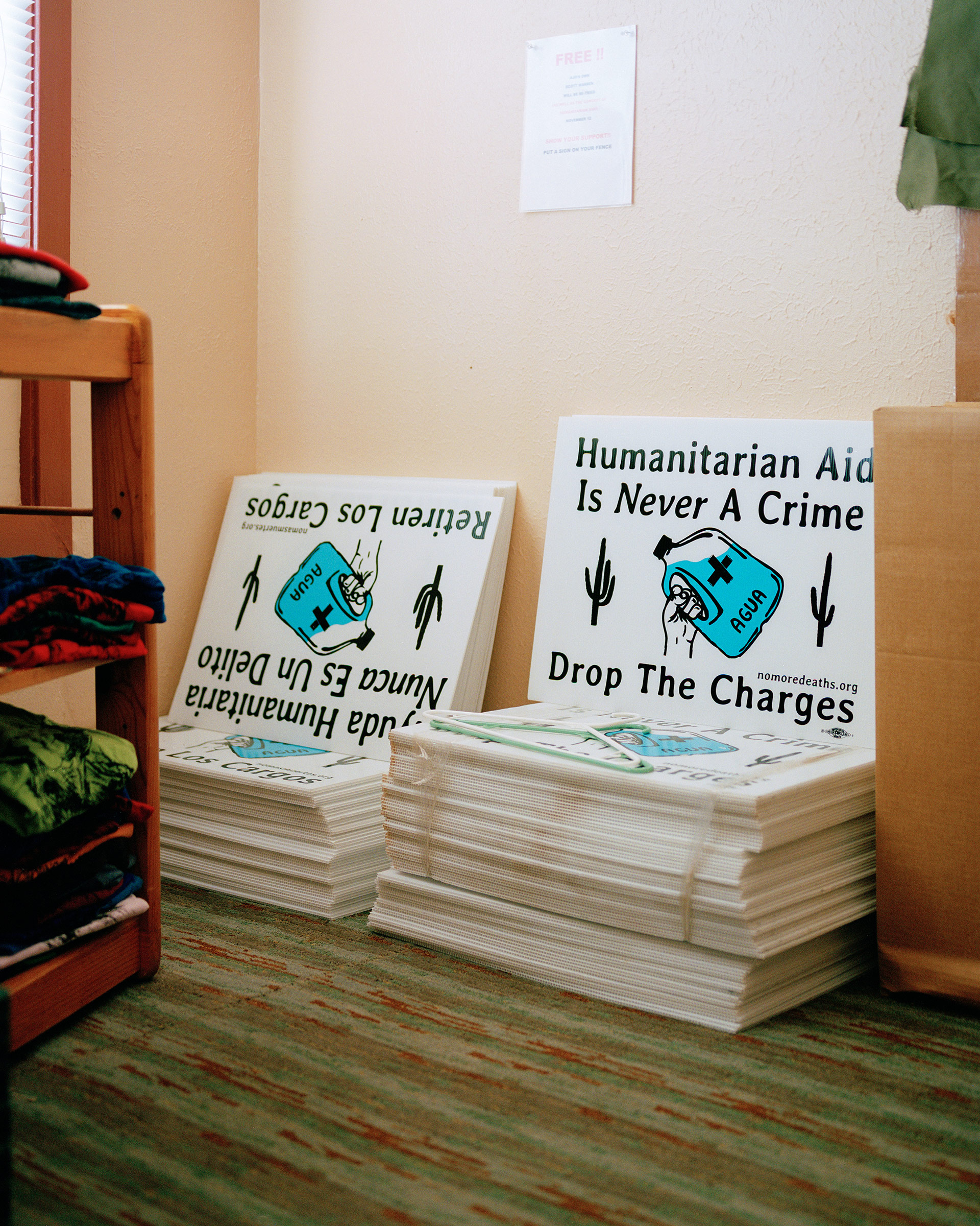 Signs in support of Warren that are available for businesses and homes sit in the Ajo Humanitarian Aid Office on Sept. 17. (Cassidy Araiza for TIME)