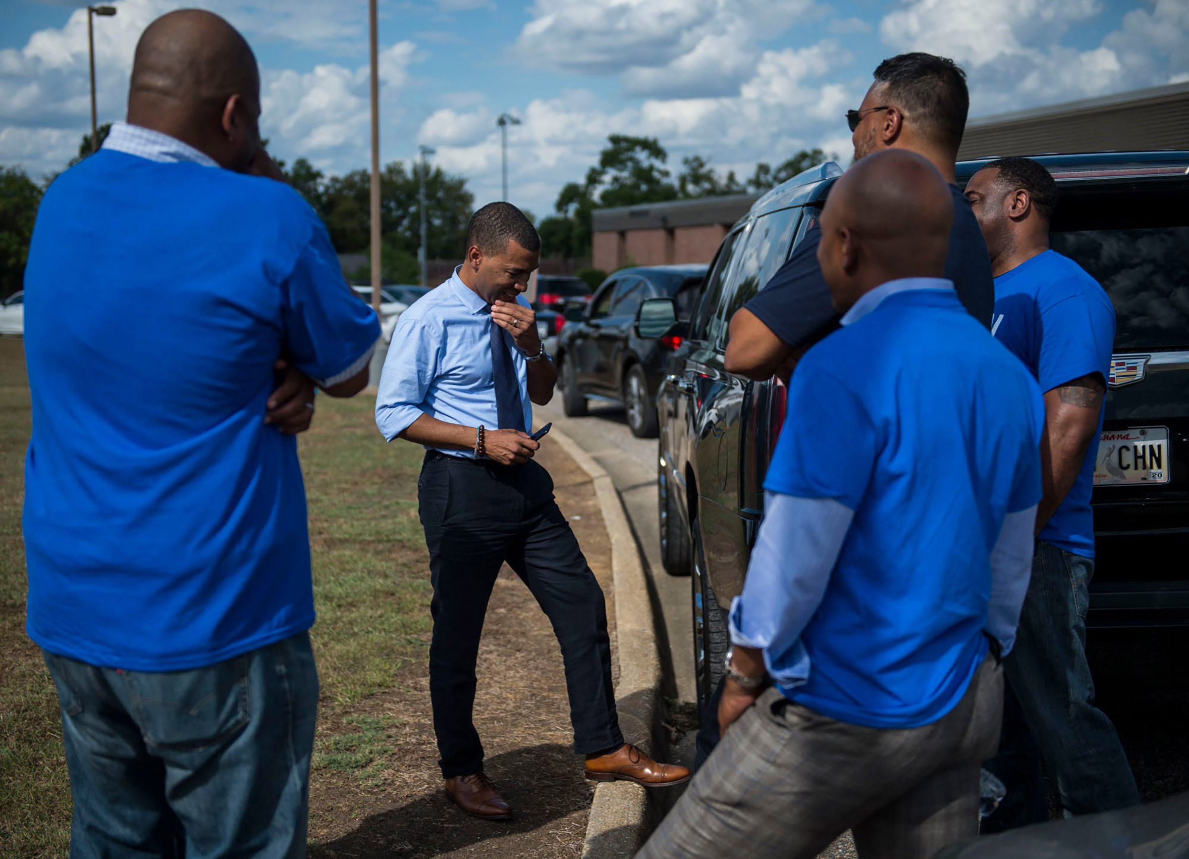 Mayoral candidate Steven Reed talks with his team at Southlawn Elementary School in Montgomery, Ala., on Oct. 8. (Jake Crandall—Montgomery Advertiser/ImagnUSA TODAY/Sipa)