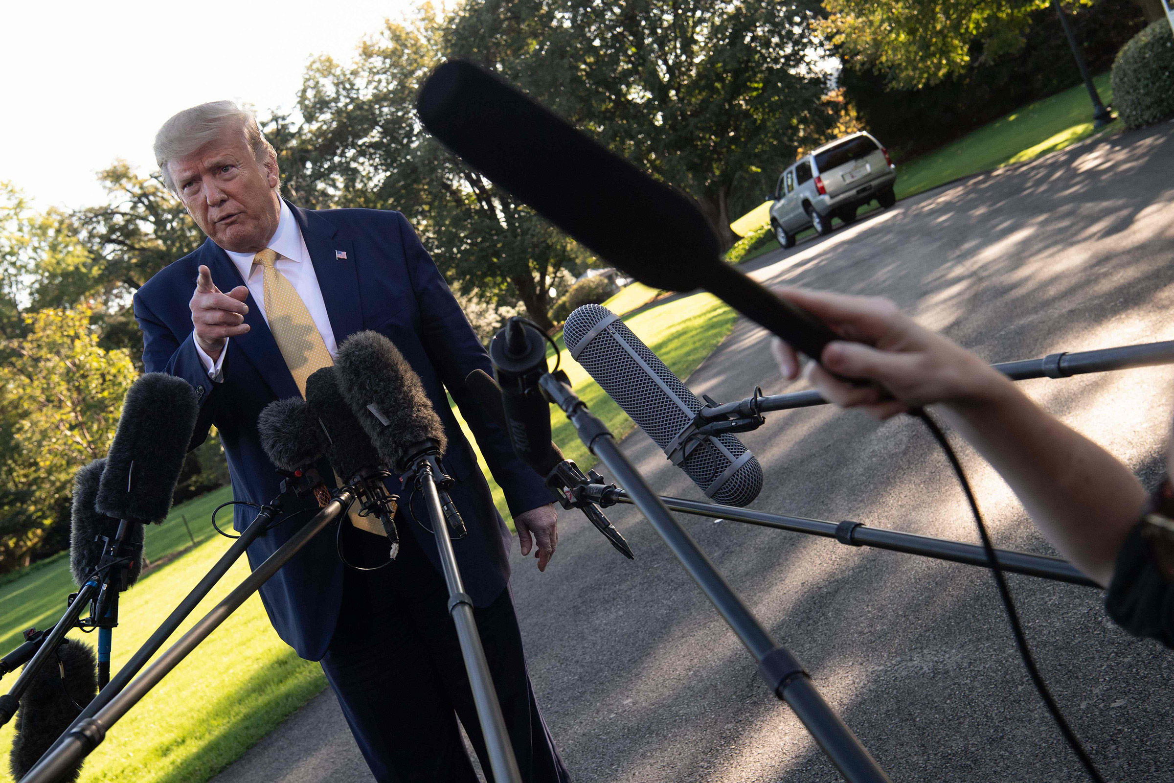 President Donald Trump speaks to the press from the South Lawn of the White House after announcing and initial deal with China in Washington on Oct. 11, 2019. (Nicholas Kamm—AFP/Getty Images)