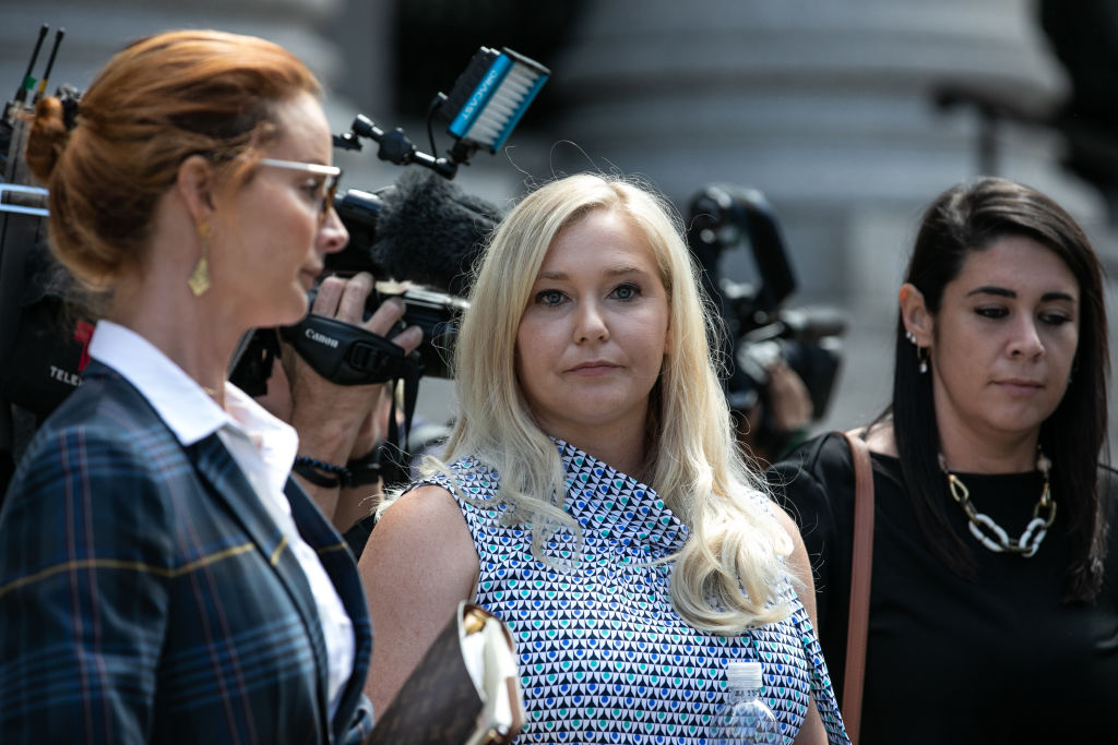Virginia Giuffre, an alleged victim of Jeffrey Epstein, center, exits from federal court in New York, U.S., on Tuesday, Aug. 27, 2019. (Jeenah Moon—Bloomberg via Getty Images)
