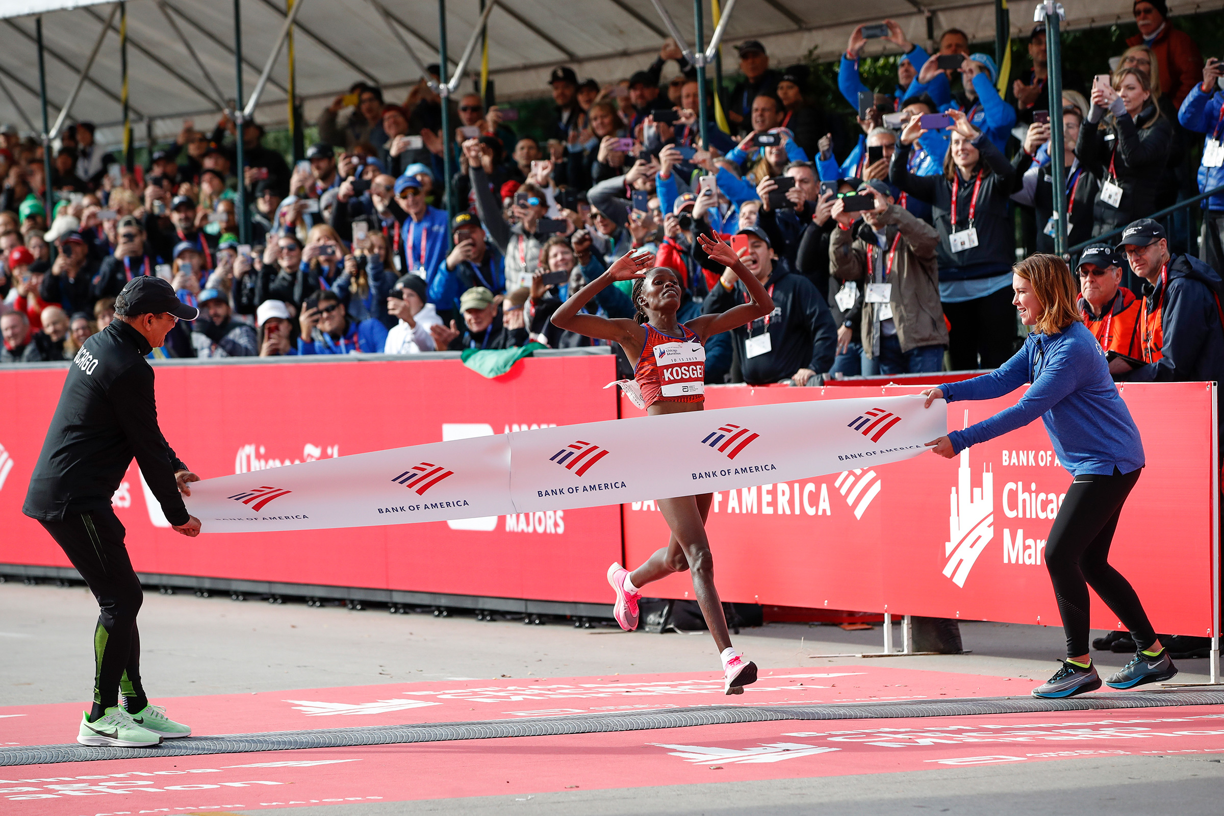 Kenya's Brigid Kosgei crosses the finish line as she wins the women's 2019 Bank of America Chicago Marathon on Oct. 13 2019.