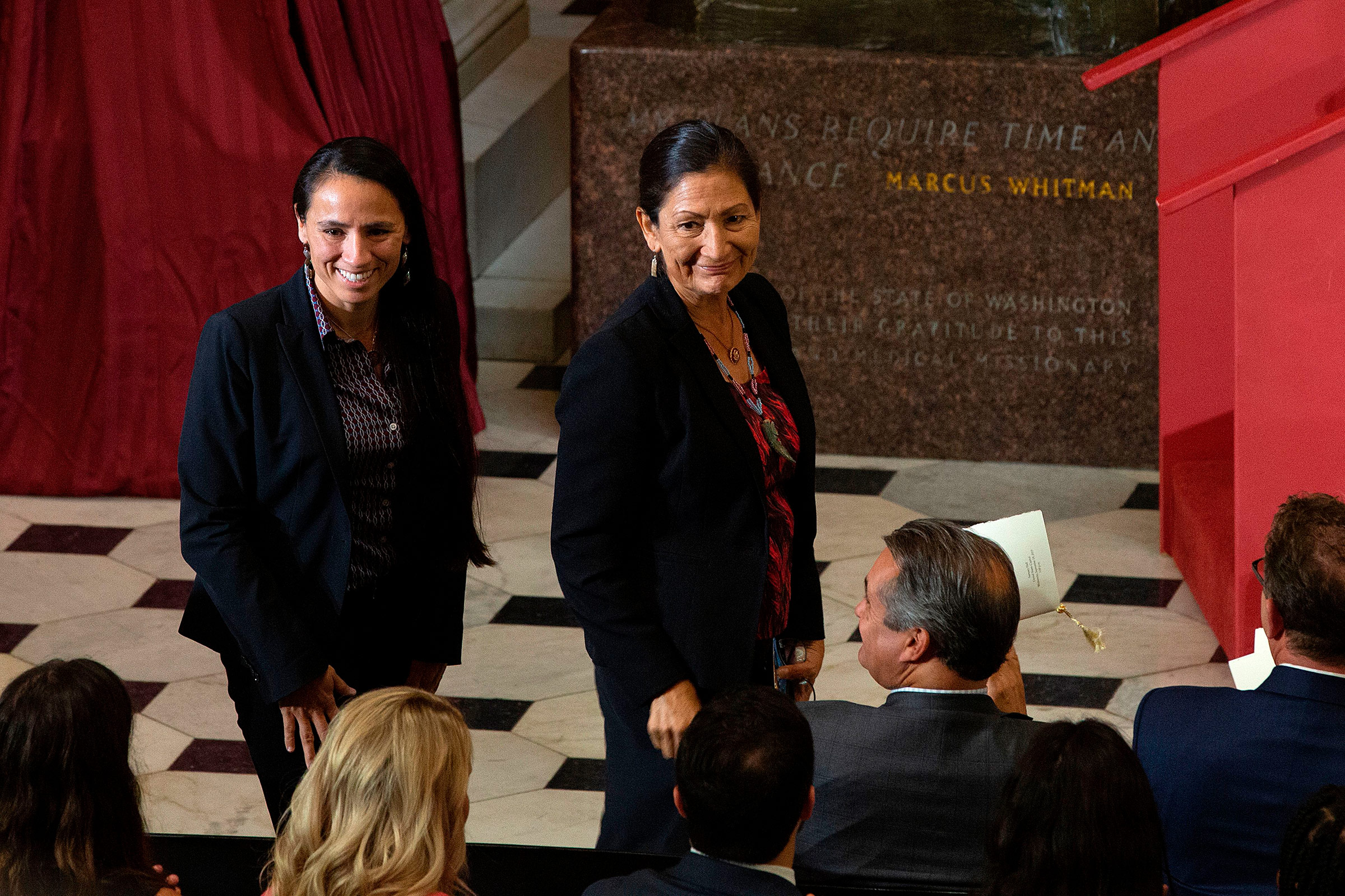 U.S. Representatives Sharice Davids, left, and Deb Haaland are recognized as the first Native American women elected to Congress during a dedication and unveiling ceremony for a statue of Ponca Chief Standing Bear of Nebraska on Capitol Hill in Washington, DC, on Sept. 18, 2019.