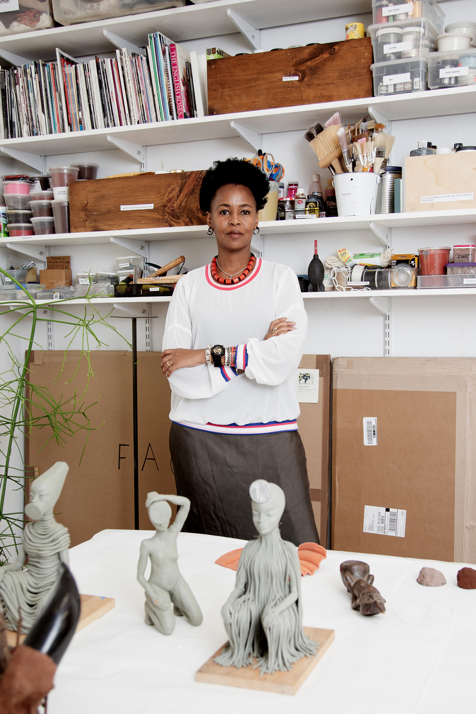 Artist Wangechi Mutu in her Brooklyn studio with models for her sculptures that were installed outside the Metropolitan Museum of Art in New York, Sept. 26, 2019.