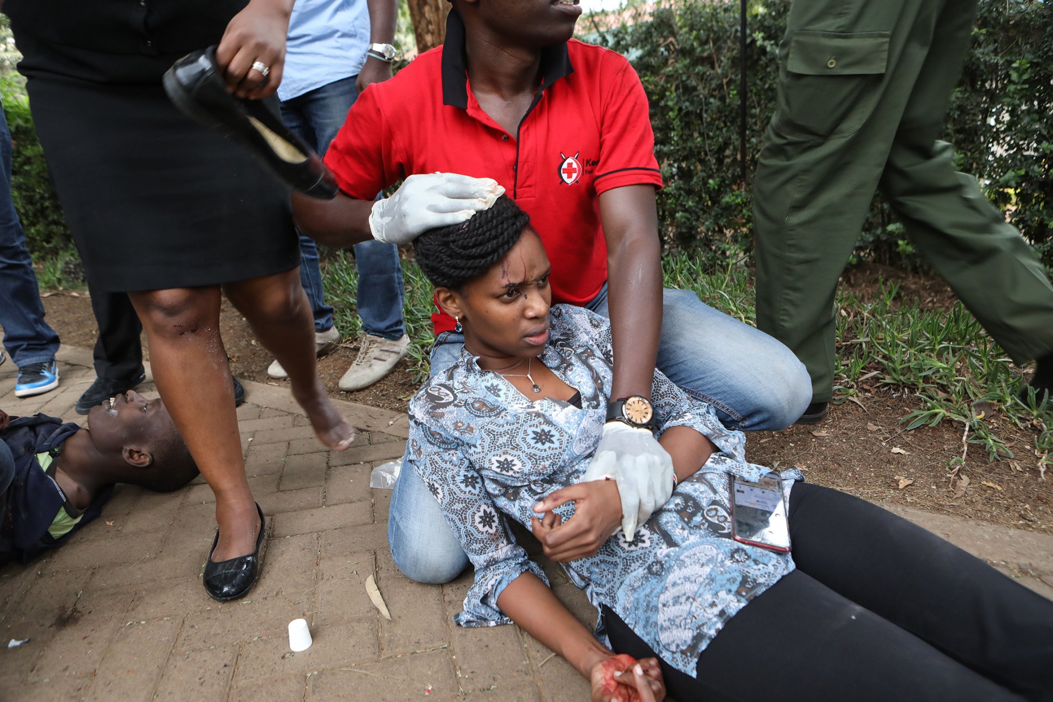 A woman receives medical attention after an apparent terrorist attack on an upscale hotel in Nairobi on Jan. 15. More than a dozen people were killed.