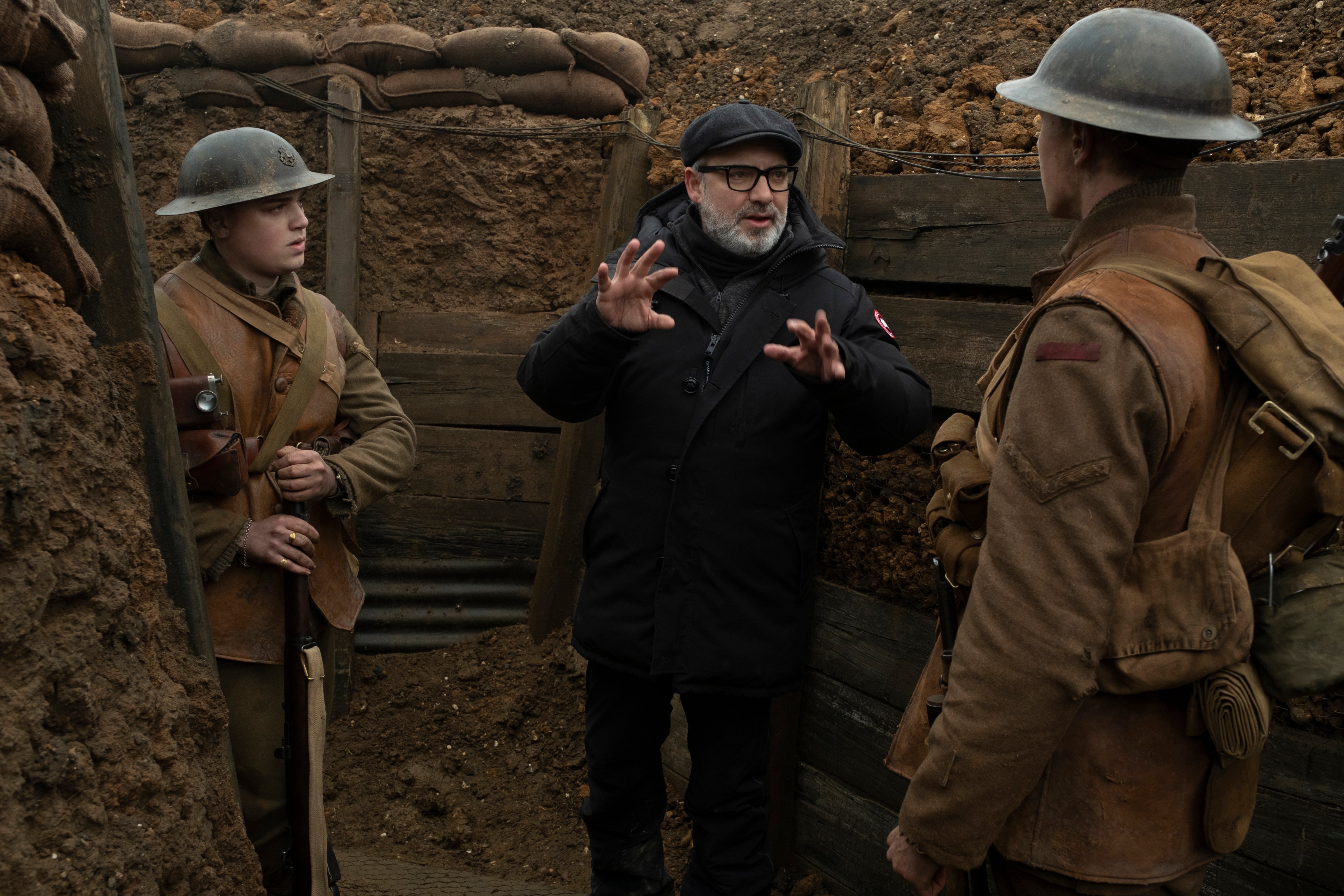 Sam Mendes in the trenches on the set of '1917.' (François Duhamel—© 2019 Universal Pictures and Storyteller Distribution Co., LLC. All Rights Reserved.)