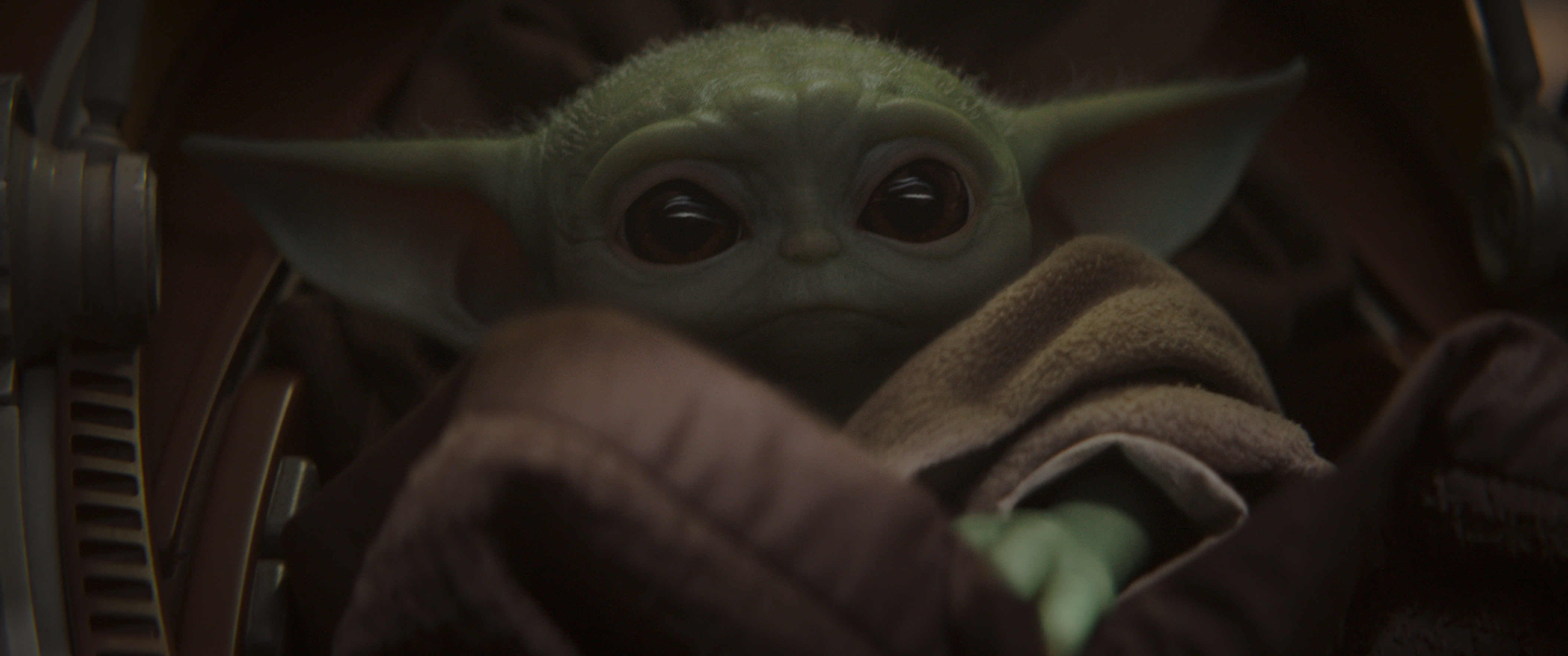 This image provided by Disney Plus shows a scene from "The Mandalorian." (Disney+––APMando takes Baby Yoda and sets off on his mission to reunite the adorable child with his wards—whoever they may be)