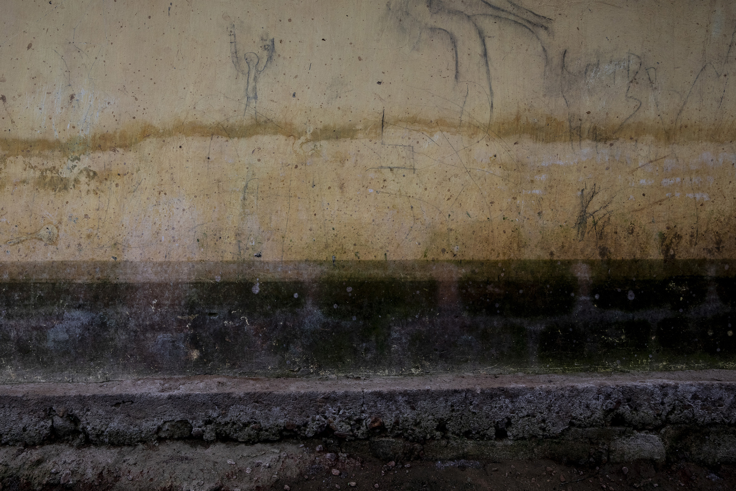 Water marks showing the flooding are seen in Georgine Kouangassam's neighbor's house on Nov.26, 2019. When the water rose in Kouangassam's house at night, everyone struggled to get out in the dark. Her granddaughter Angela, 3, drowned. (Adrienne Surprenant—Greenpeace)
