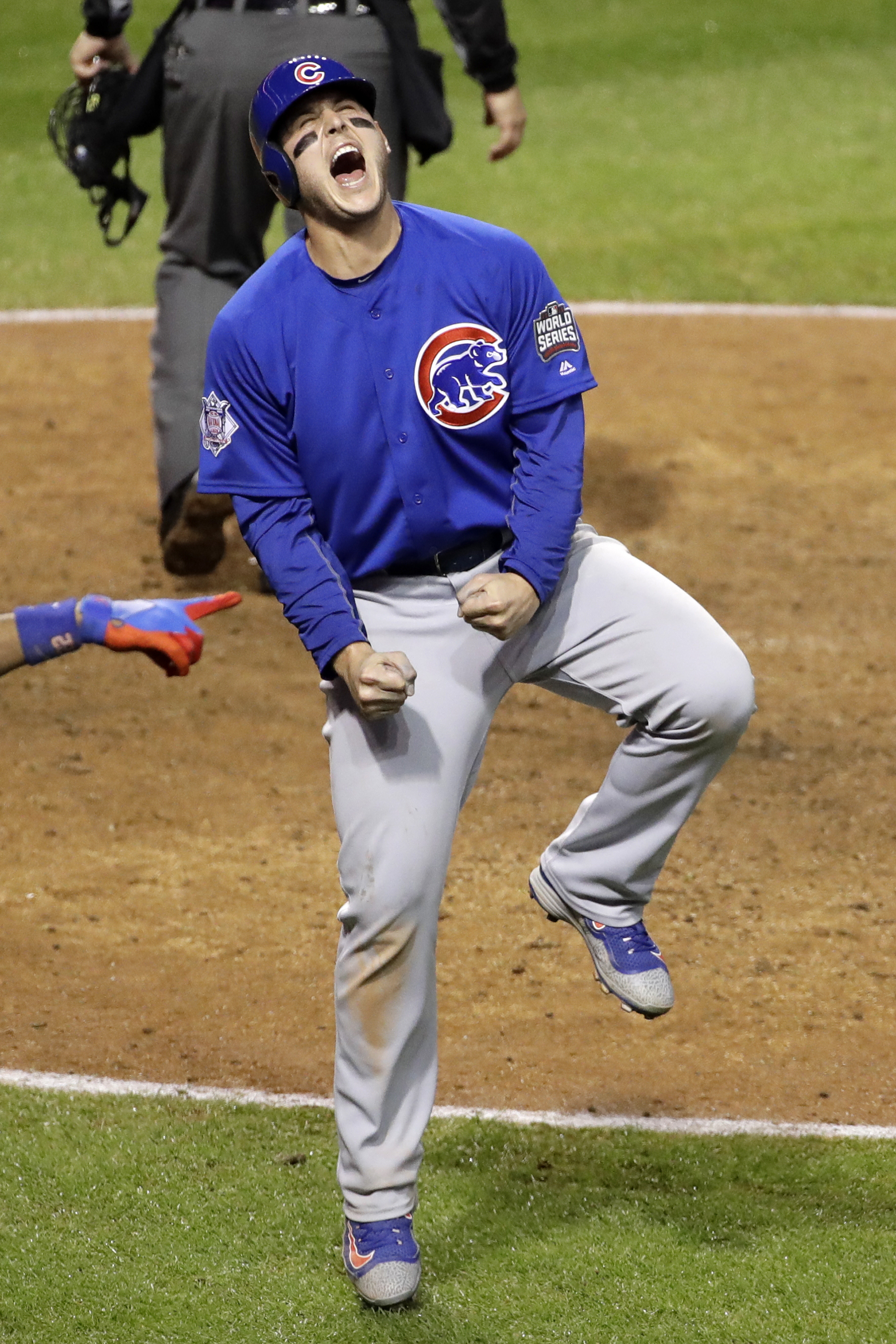 Chicago Cubs' Anthony Rizzo reacts after scoring on a hit by Miguel Montero during the 10th inning of Game 7 of the Major League Baseball World Series against the Cleveland Indians Wednesday, Nov. 2, 2016, in Cleveland. (Gene J. Puskar–AP)