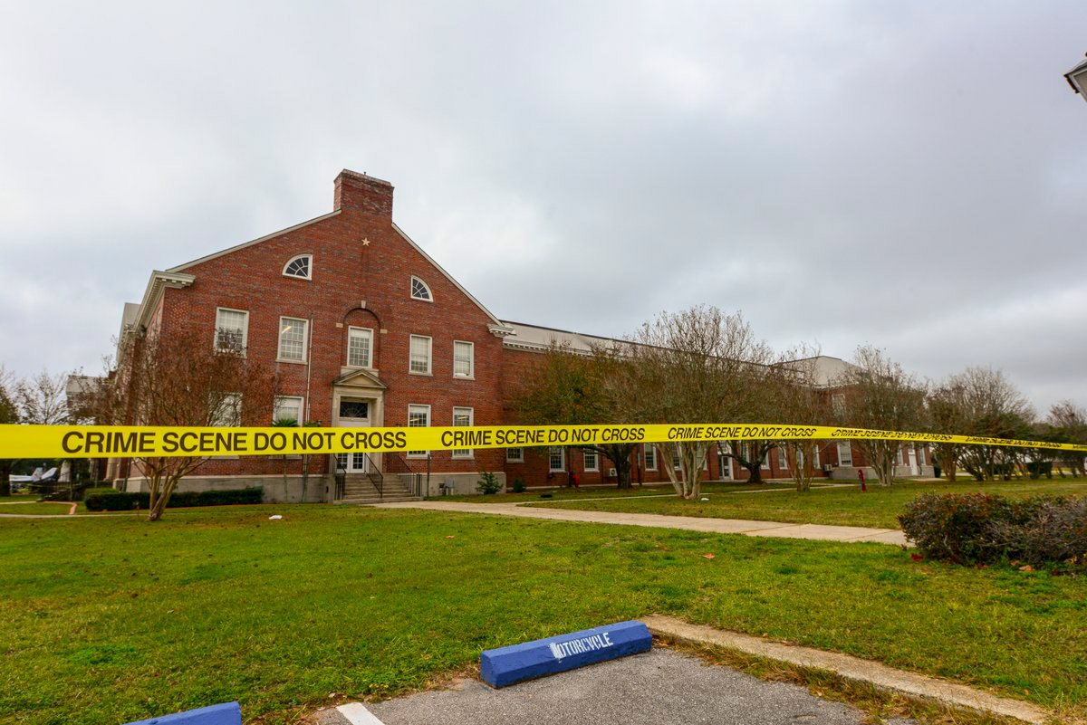Police tape stretches across a street near a building after an active shooting incident at a naval base in Pensacola, Fla. on Dec. 7, 2019. (FBI/AFP/Getty Images)
