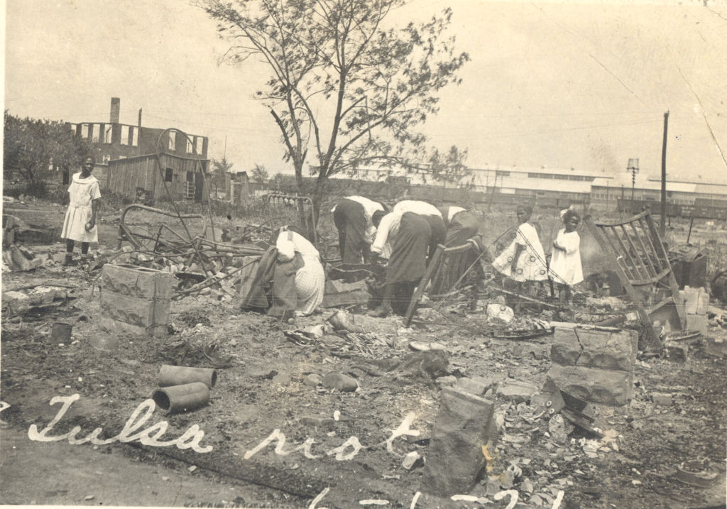 Photograph of people searching through rubble after the Tulsa Race Riot, Tulsa, Oklahoma, June 1921. (Getty Images)