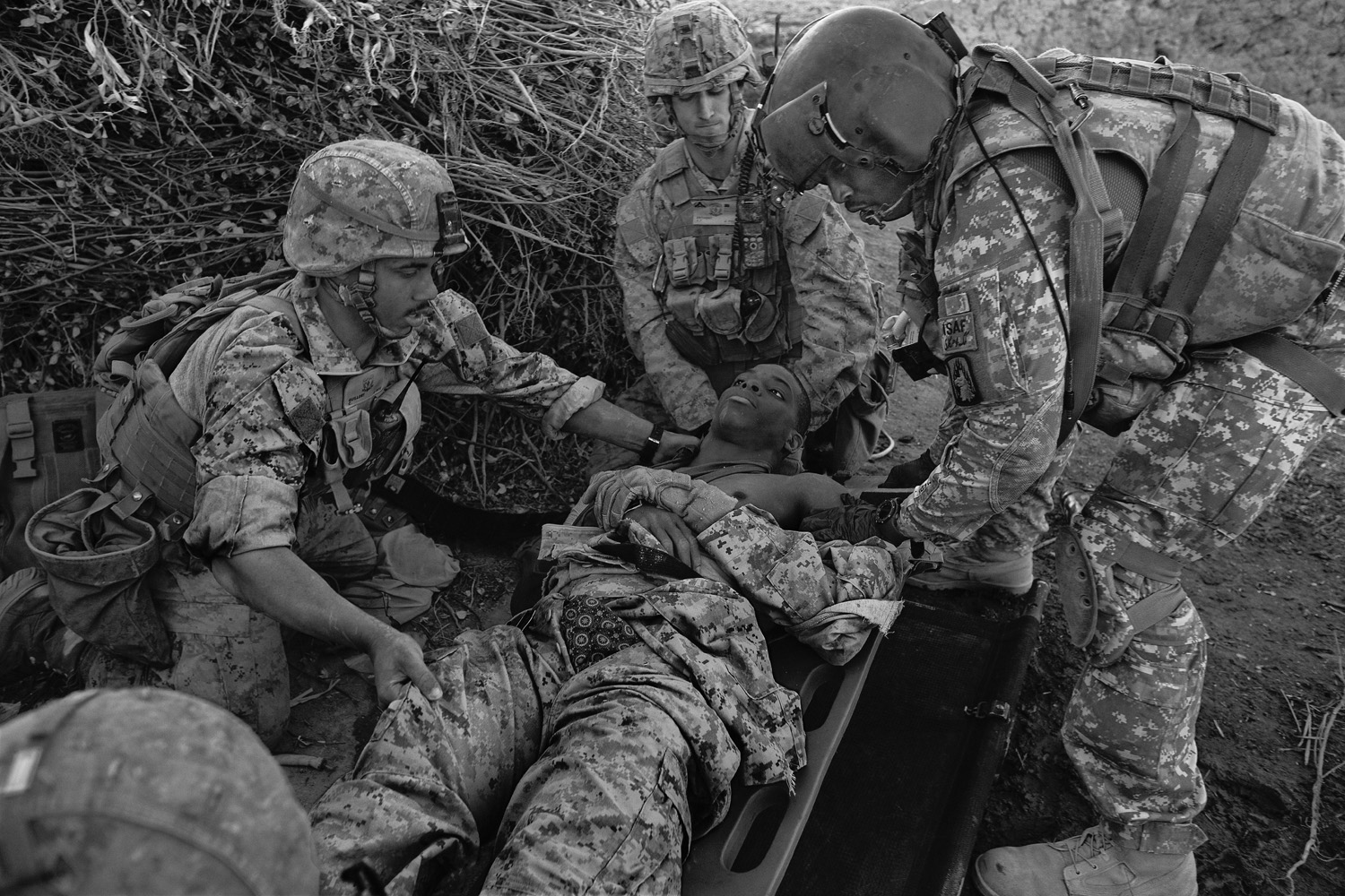 Medevac crew members prepare to evacuate a wounded Marine in Helmand province in 2010