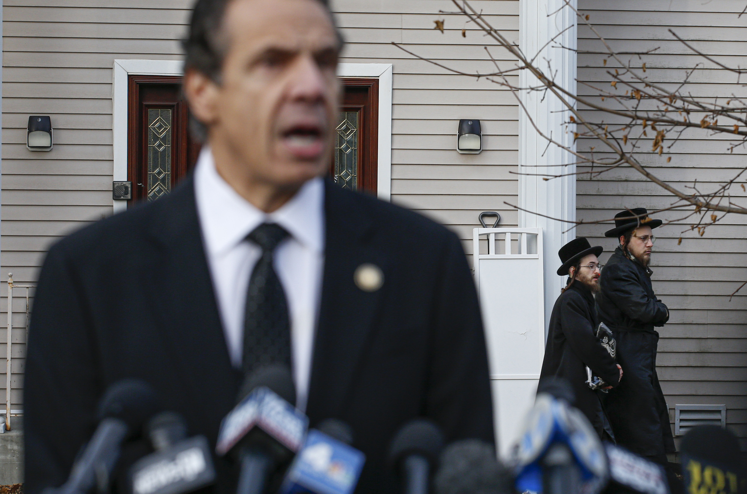 New York Governor Andrew Cuomo speaks to the media outside the home of Rabbi Chaim Rottenberg in Monsey, New York on Dec. 29, 2019. (Kena Betancur—AFP/Getty Images))