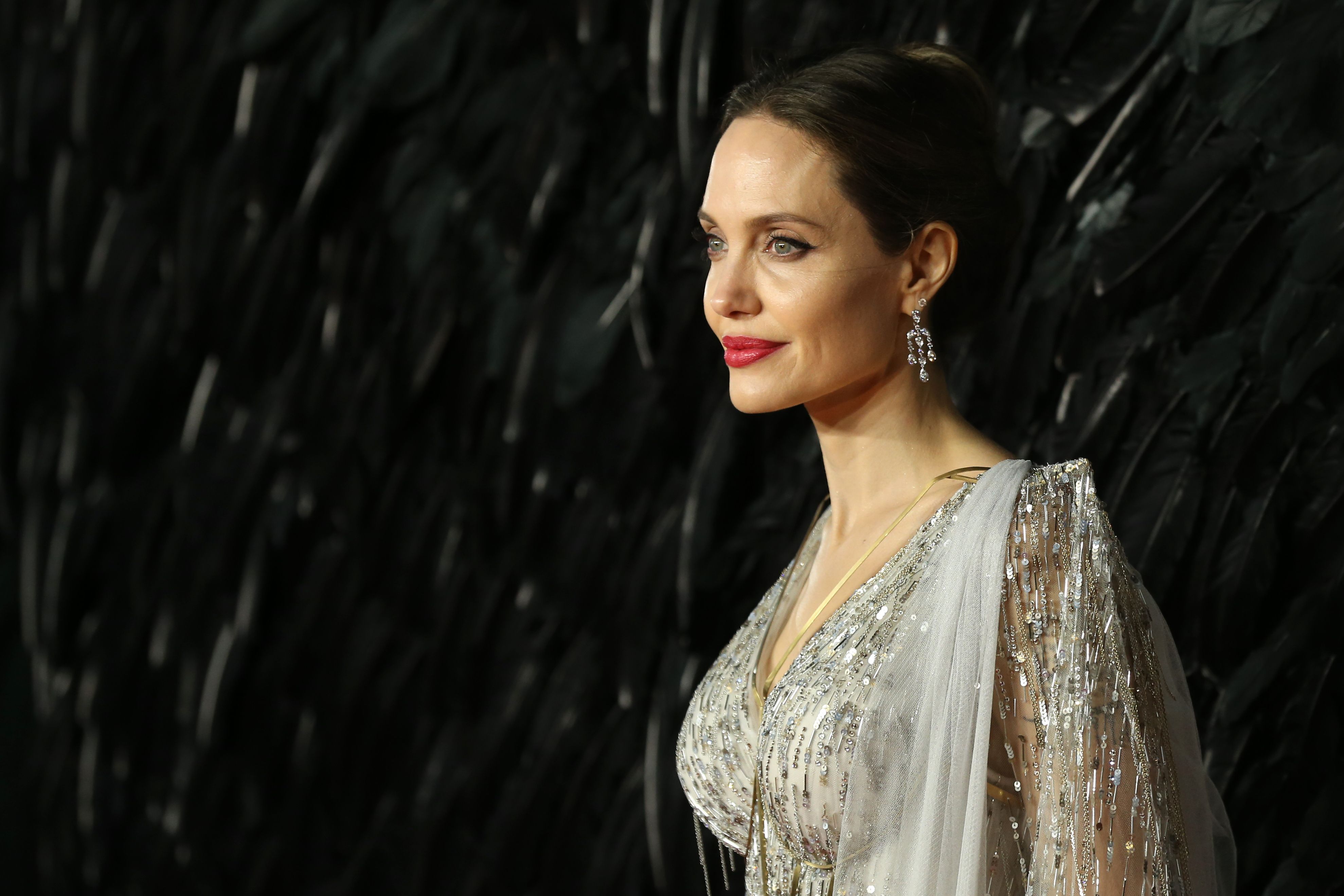 US actress Angelina Jolie poses on the red carpet upon arrival for the European premiere of the film "Maleficent:Mistress of Evil" in London on October 9, 2019. (Photo by ISABEL INFANTES / AFP) (Photo by ISABEL INFANTES/AFP via Getty Images) (AFP via Getty Images)