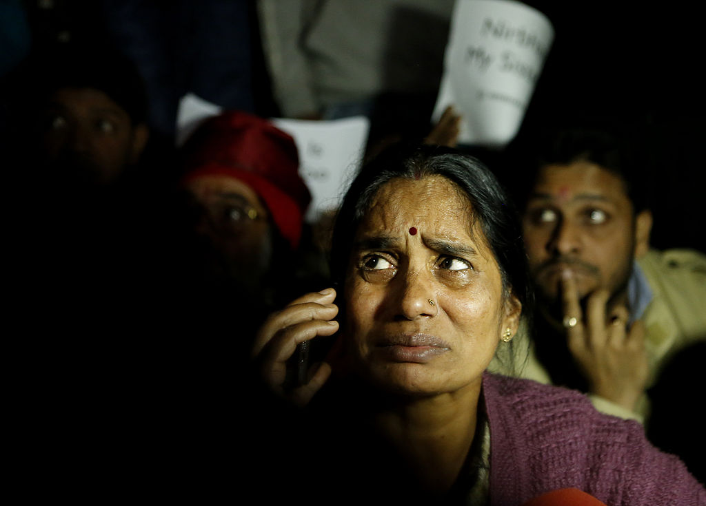 Mother of Nirbhaya breaks down during a protest against the release of juvenile convict of the 16 December gang-rape, along with student activists at Jantar Mantar on December 20, 2015 in New Delhi, India. (Photo by Ravi Choudhary/Hindustan Times via Getty Images)