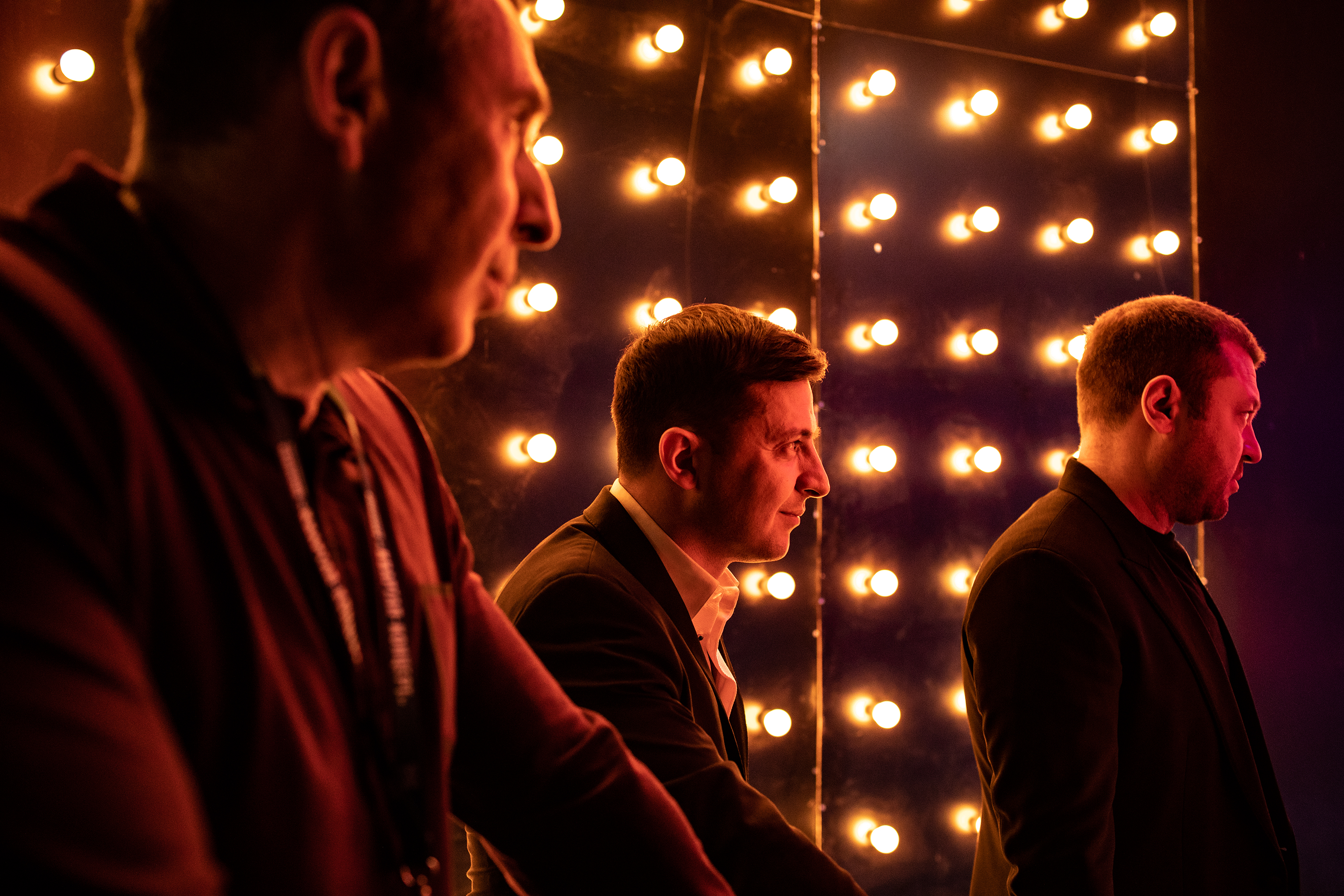 Volodymyr Zelensky, center, watches from the wings as his colleagues perform during a televised comedy sketch show in Kiev on March 13. Zelensky was later elected to the presidency. (Anastasia Taylor-Lind for TIME)