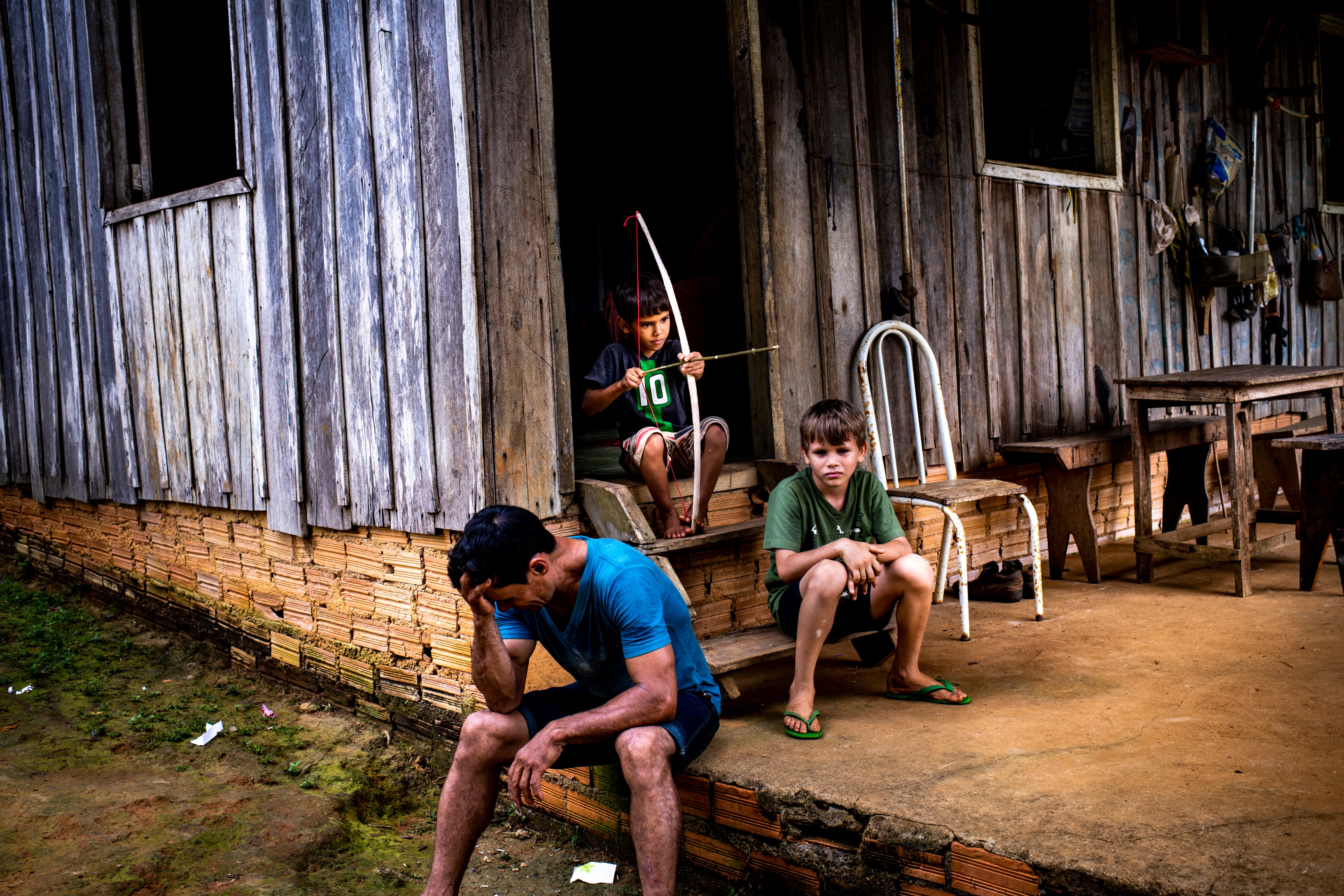 Rubber tappers work on government-protected land, which provides a bulwark against deforestation. But one rubber tapper, Marcelo Firmiano da Silva, photographed with two sons on Feb. 16, says 18 of his colleagues have been killed since 2002. Sept. 23 issue. (Sebastián Liste—NOOR for TIME)