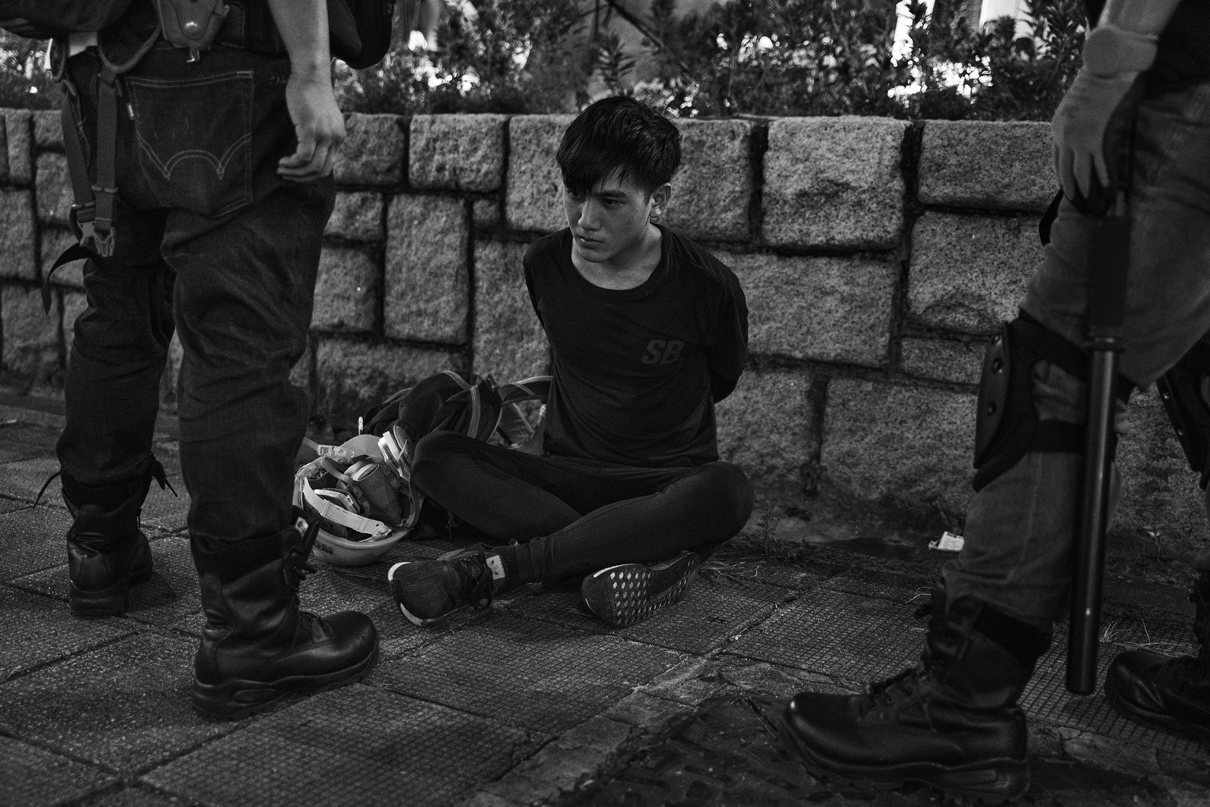 On Aug. 11, an antigovernment protester is arrested near the Tsim Sha Tsui police station in Kowloon, Hong Kong. Aug. 26 issue. (Adam Ferguson for TIME)