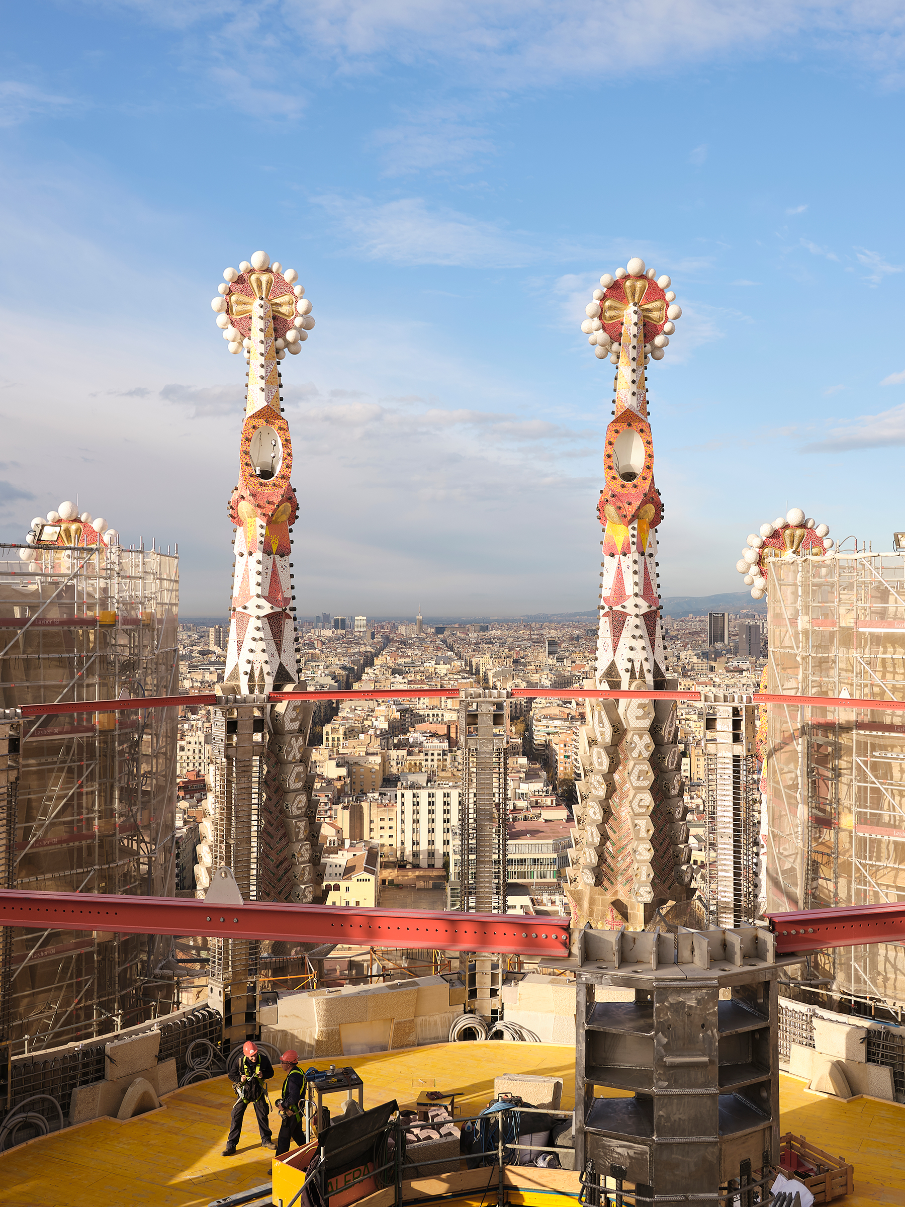 Workers atop the Sagrada Familia, one of the world's longest-running construction projects, in Barcelona in March. July 8 issue. (Luca Locatelli for TIME)