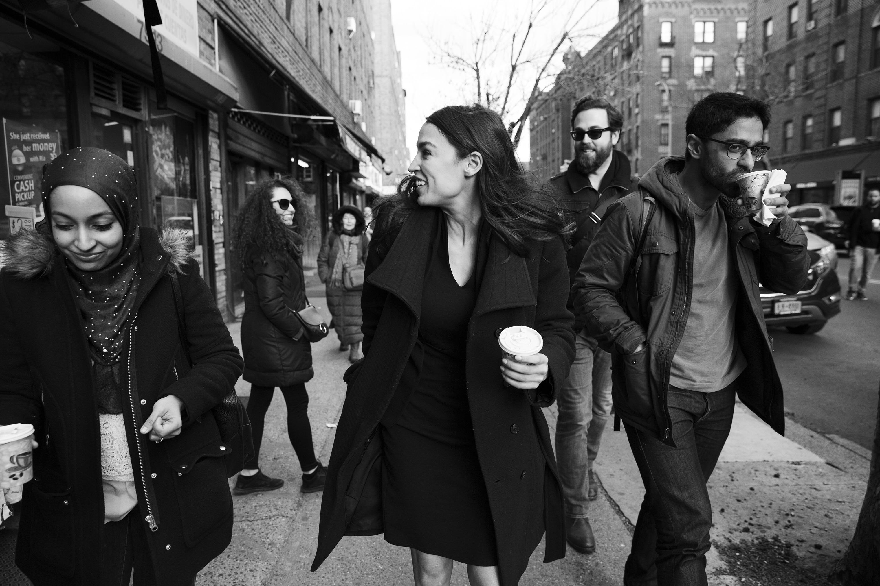 Rep. Alexandria Ocasio-Cortez walks down 37th Avenue with her staff towards her office in Jackson Heights, Queens. April 1 issue. (Krisanne Johnson for TIME)
