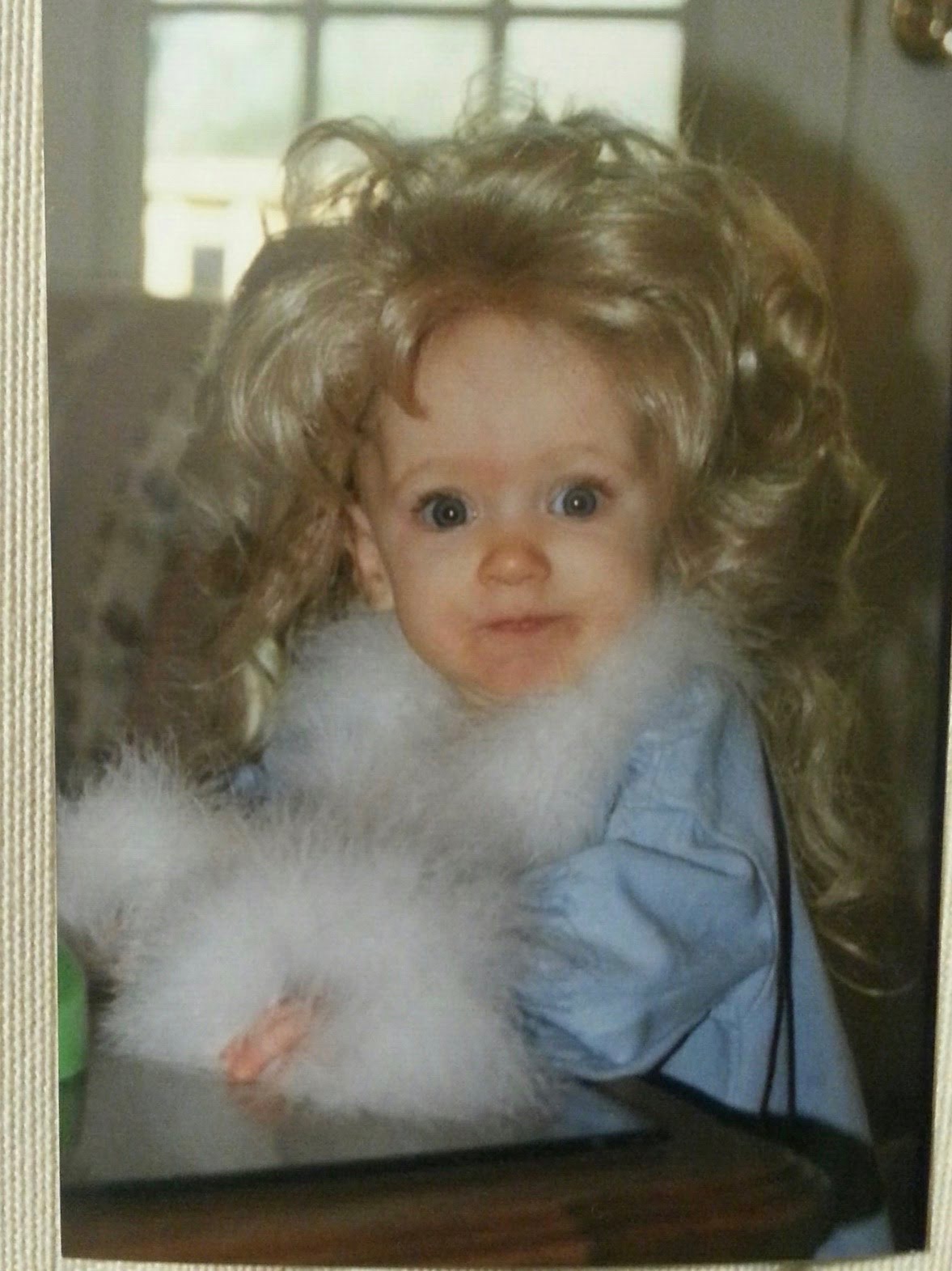 Tomlinson has always been one for performing—and "Dolly Parton" hair. (Courtesy of Brittany Tomlinson)