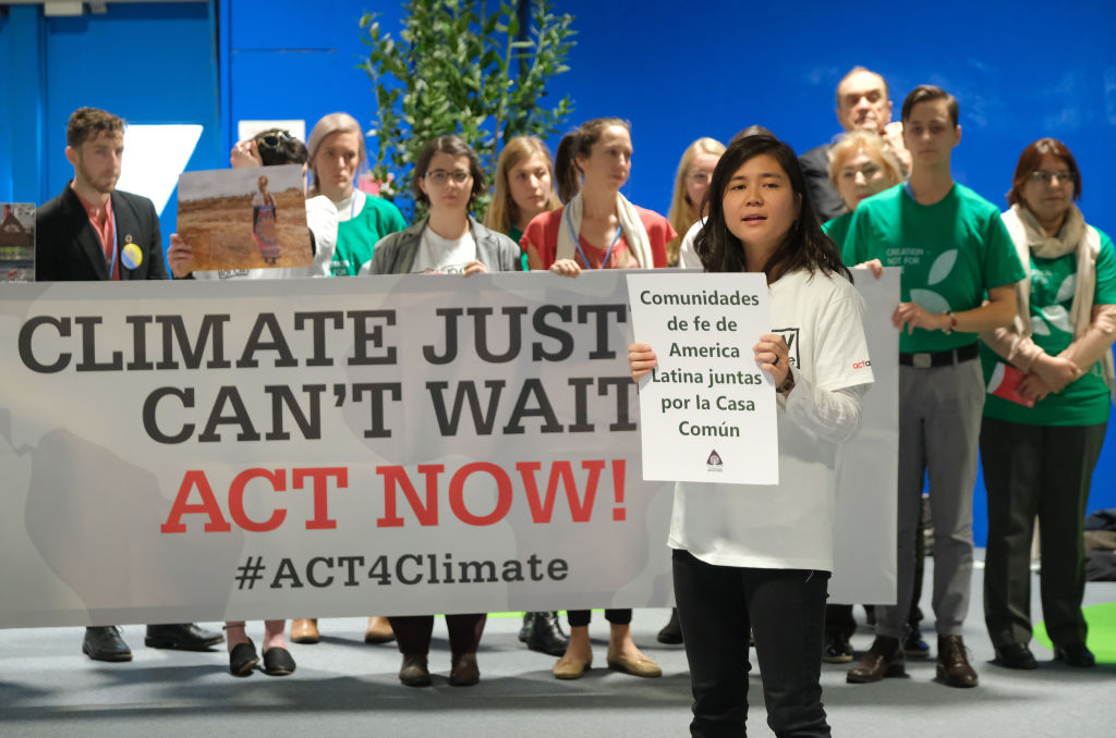 Members of Christian youth groups from the Americas hold a demonstration at the COP25 climate conference in Madrid, Spain on Dec. 3, 2019. (Sean Gallup—Getty Images)