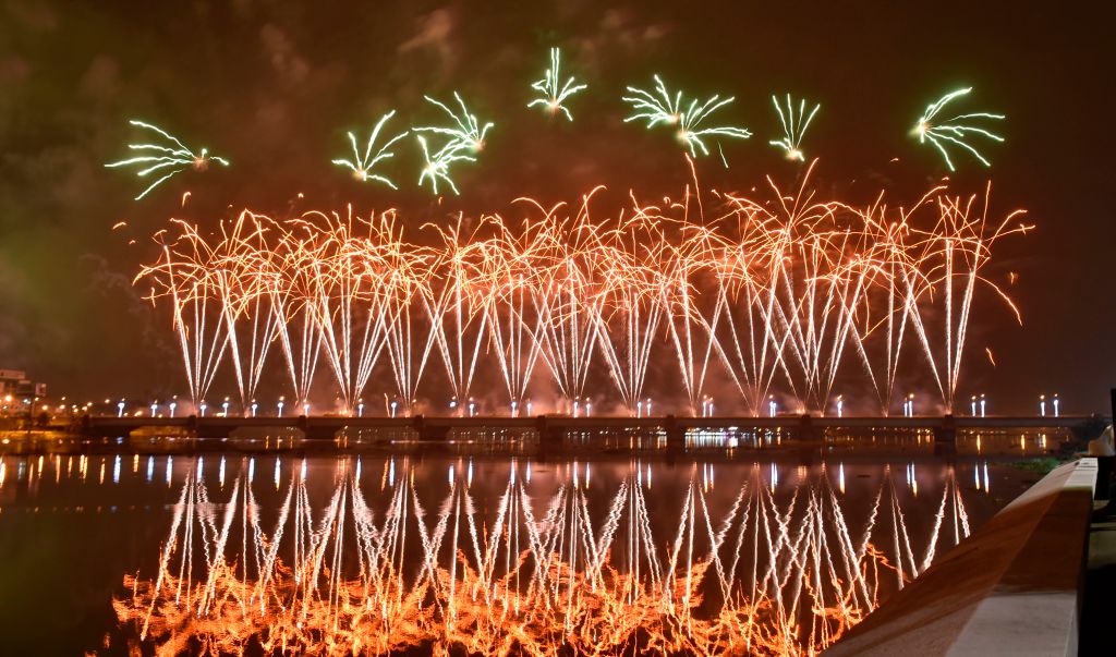 Fireworks light up the sky over the General de Gaulle bridge and the Ebrie lagoon during New Year's celebrations in Abidjan early on Jan. 1, 2020. (Sia Kambou—AFP/Getty Images)