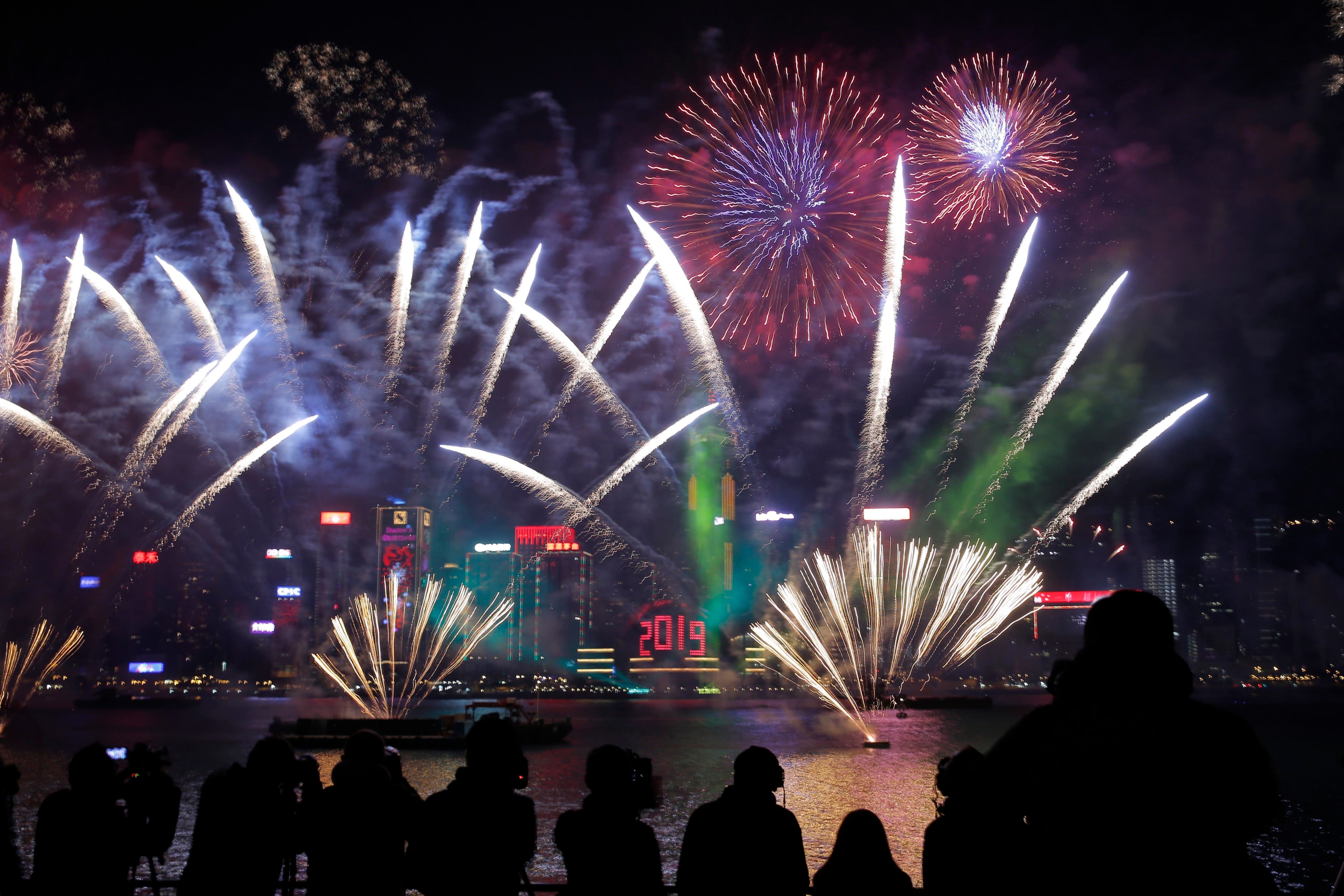 New Year's Eve fireworks explode over the Victoria Harbor in Hong Kong on Jan 1, 2019. (Kin Cheung—AP)