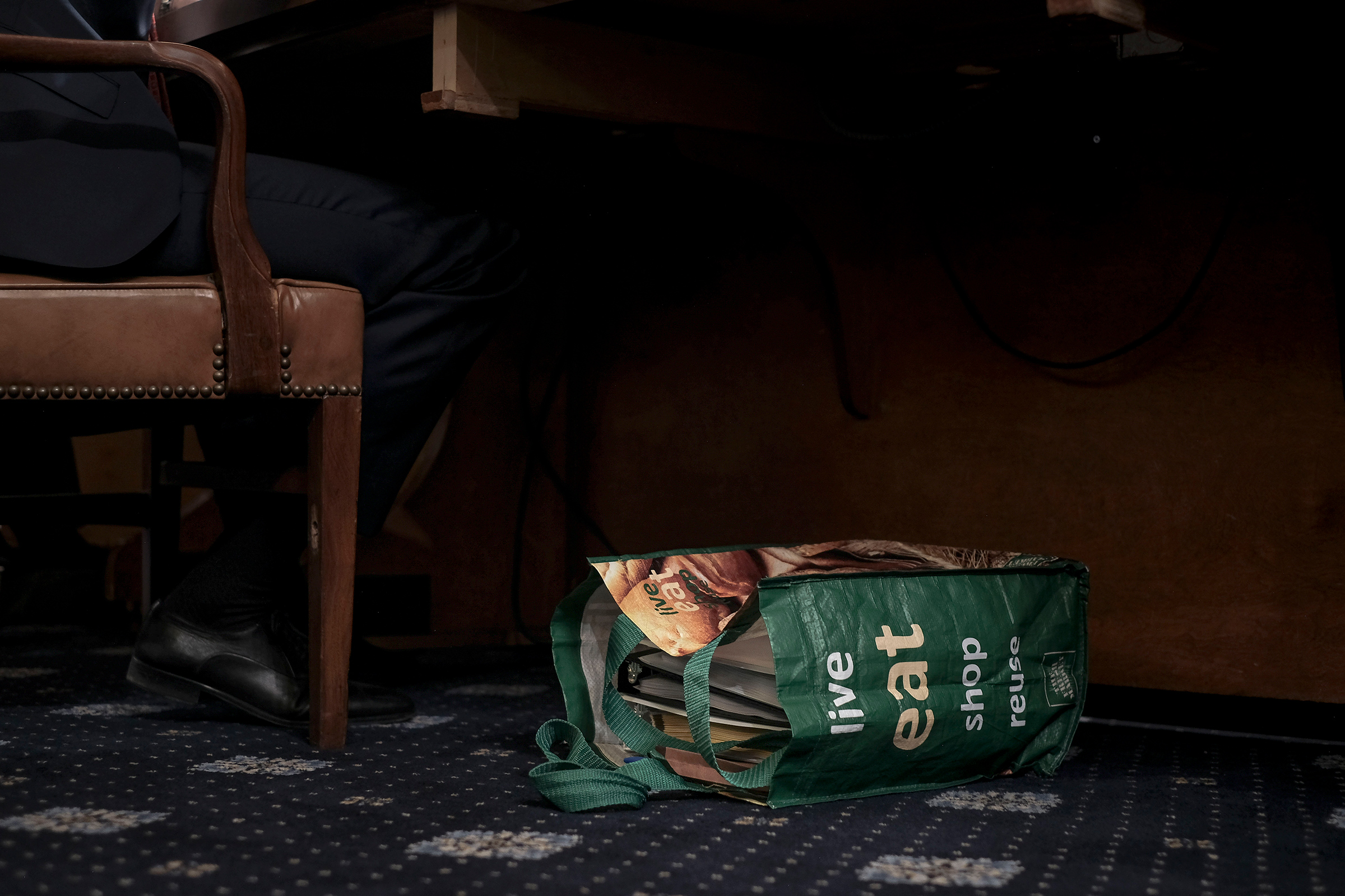 A reusable shopping bag filled with documents and notes sit at the feet of Stephen Castor, the Republican counsel to the Judiciary and Intelligence committee, at the beginning of the House Judiciary Committee hearing on the impeachment inquiry in Washington, D.C., on Dec. 9, 2019.