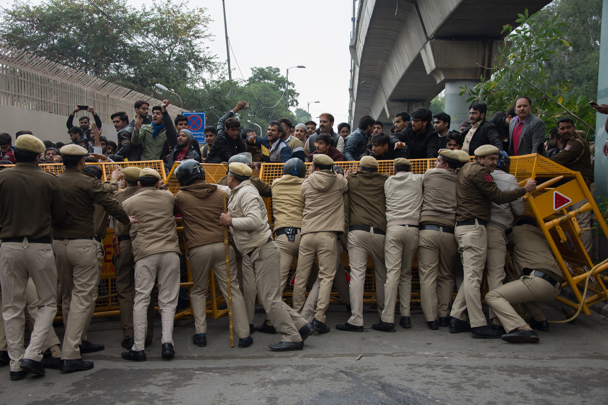 Protests against the controversial Citizenship Amendment Act turned violent when Delhi Police shot tear gas and beat students at Jamia Millia Islamia University in Delhi, India on Dec. 13, 2019. (Javed Sultan—Anadolu Agency via Getty Images)