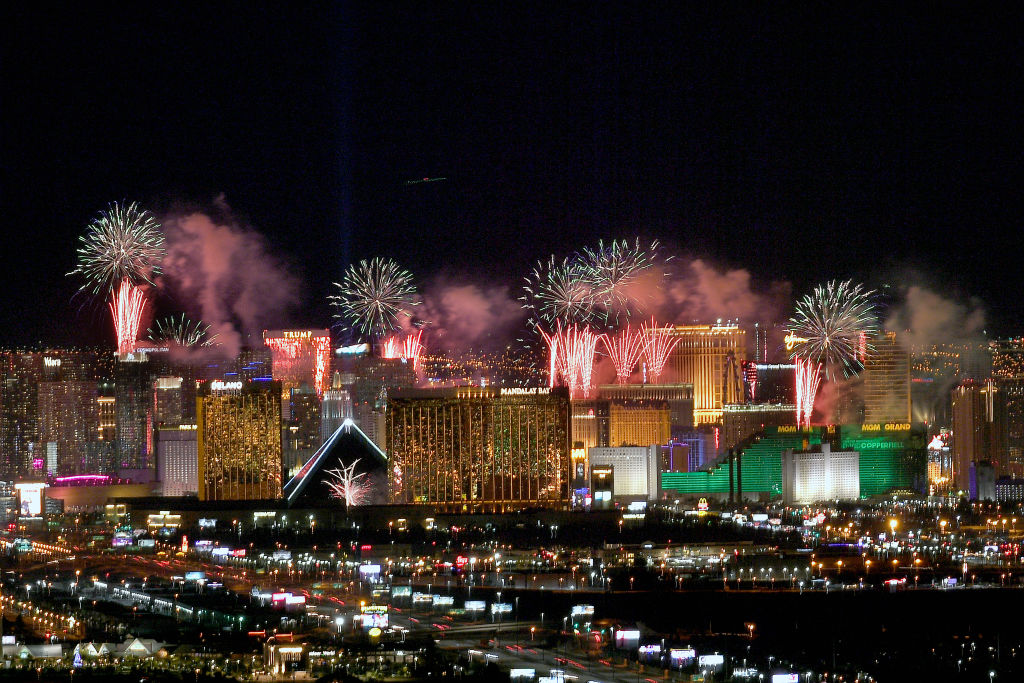 Fireworks illuminate the skyline over the Las Vegas Strip during an eight-minute-long pyrotechnics show put on by Fireworks by Grucci titled "America's Party 2020" during a New Year's Eve celebration on January 1, 2020 in Las Vegas, Nevada. About 400,000 visitors gathered to watch more than 80,000 fireworks shoot from the rooftops of seven hotel-casinos to welcome the new year. (Bryan Steffy—Getty Images)