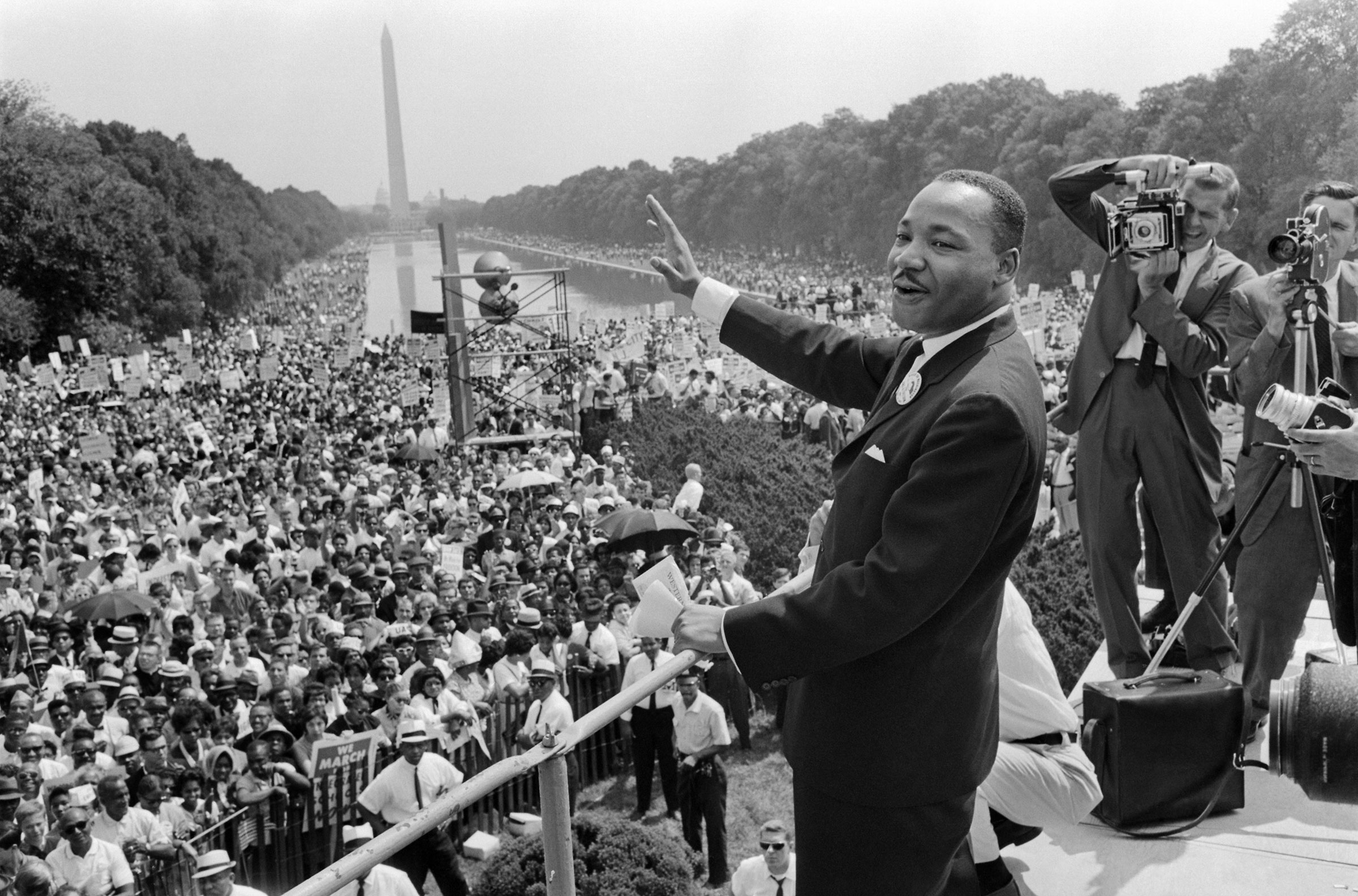 Dr. Martin Luther King, Jr. waves to supporters during the March on Washington on August 28, 1963. (AFP/Getty Images)