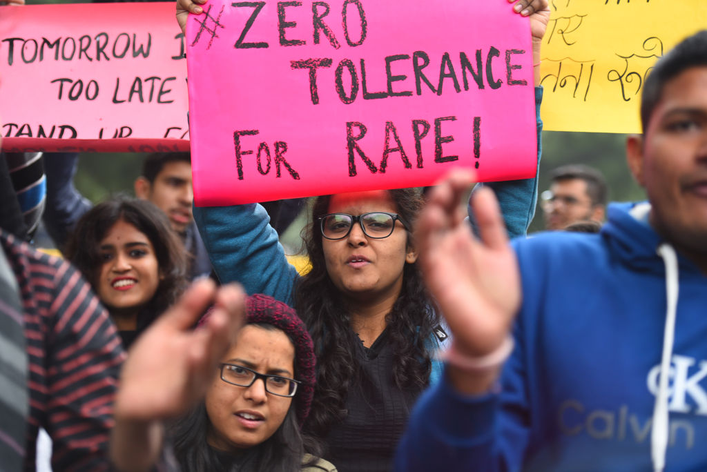 DU students and members of Asmita Theatre Group hold placards and shout slogans during a protest against government as Nirbhaya and other rape survivors haven't received justice, on the seventh anniversary of the Nirbhaya rape case, at Jantar Mantar on December 17, 2019 in New Delhi, India. (Raj K Raj/Hindustan Times via Getty Images)