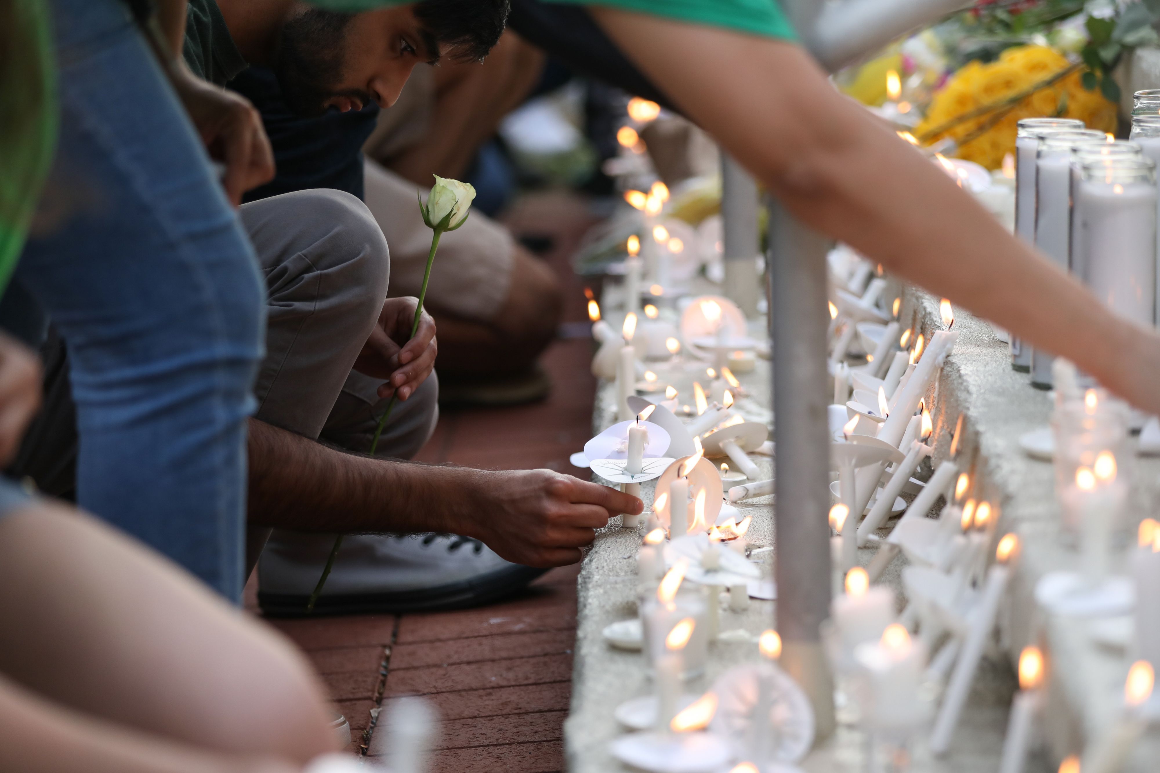 Students lay candles and flowers at the steps of Kennedy Hall to honor the victims of a shooting at  the University of North Carolina, Charlotte, North Carolina on May 1, 2019. (Logan Cyrus—AFP/Getty Images)