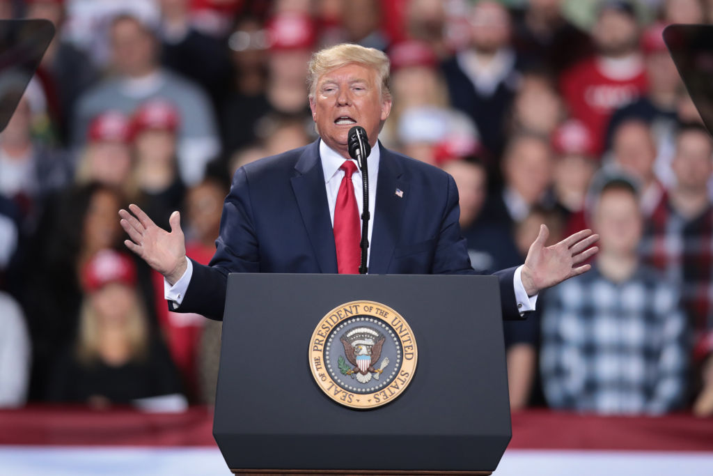 President Donald Trump addresses his impeachment during a rally in Battle Creek, Michigan. While Trump spoke at the rally, the House of Representatives voted to impeach him. (Scott Olson—Getty Images)