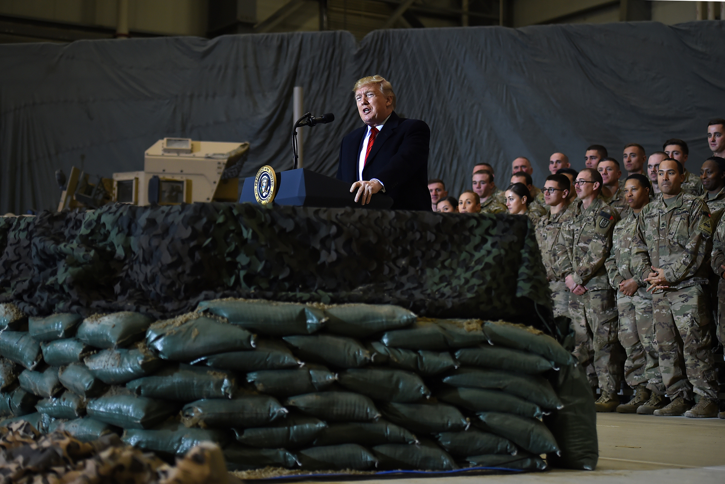 US President Donald Trump speaks to the troops during a surprise Thanksgiving day visit at Bagram Air Field in Afghanistan on Nov. 28, 2019. (Olivier Douliery—AFP via Getty Images)