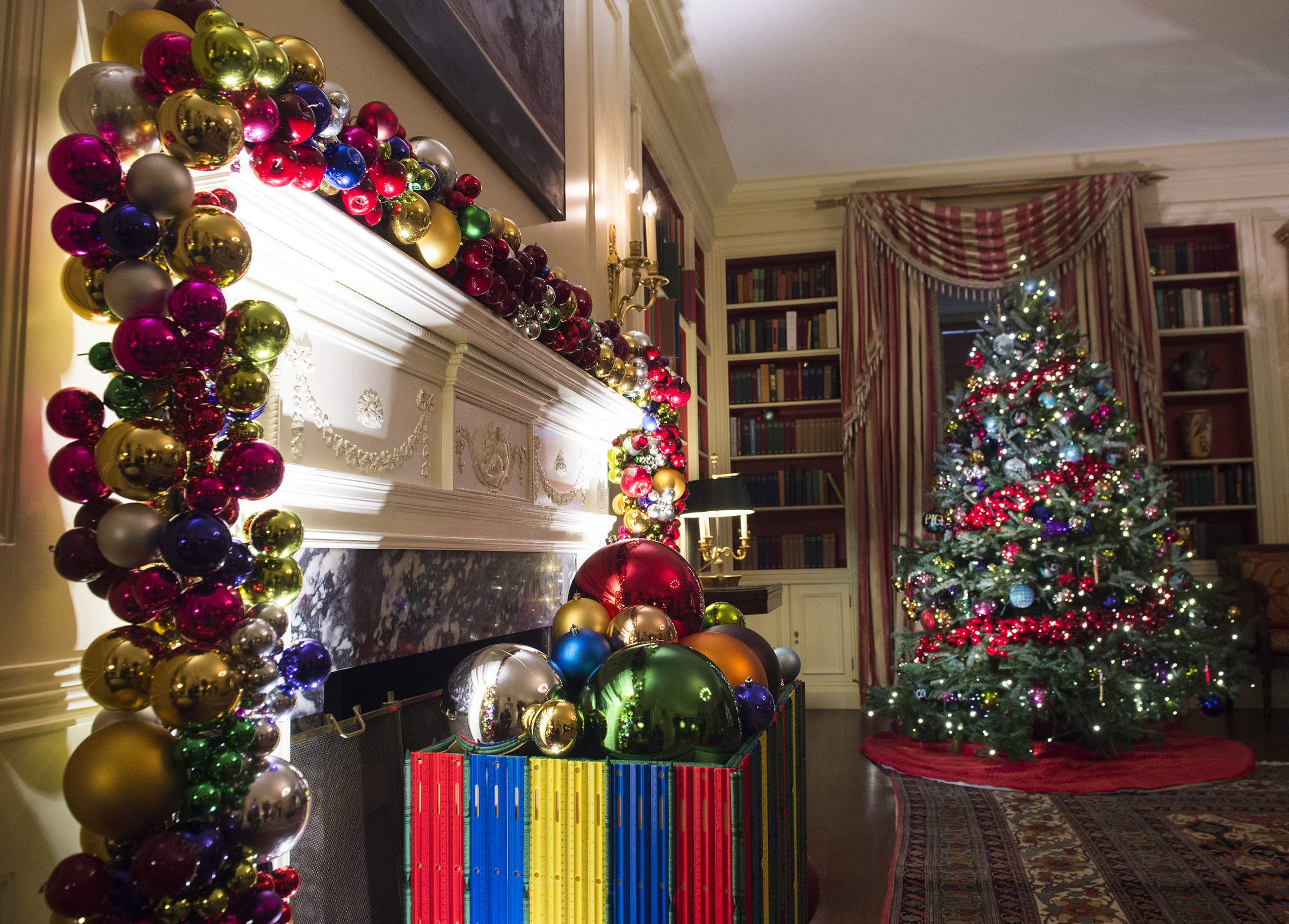 Christmas trees and holiday decorations in the theme of, "The Gift of the Holidays," are seen in the Library of the White House in Washington, D.c. on Nov. 29, 2016. (Saul Loeb—AFP via Getty Images)