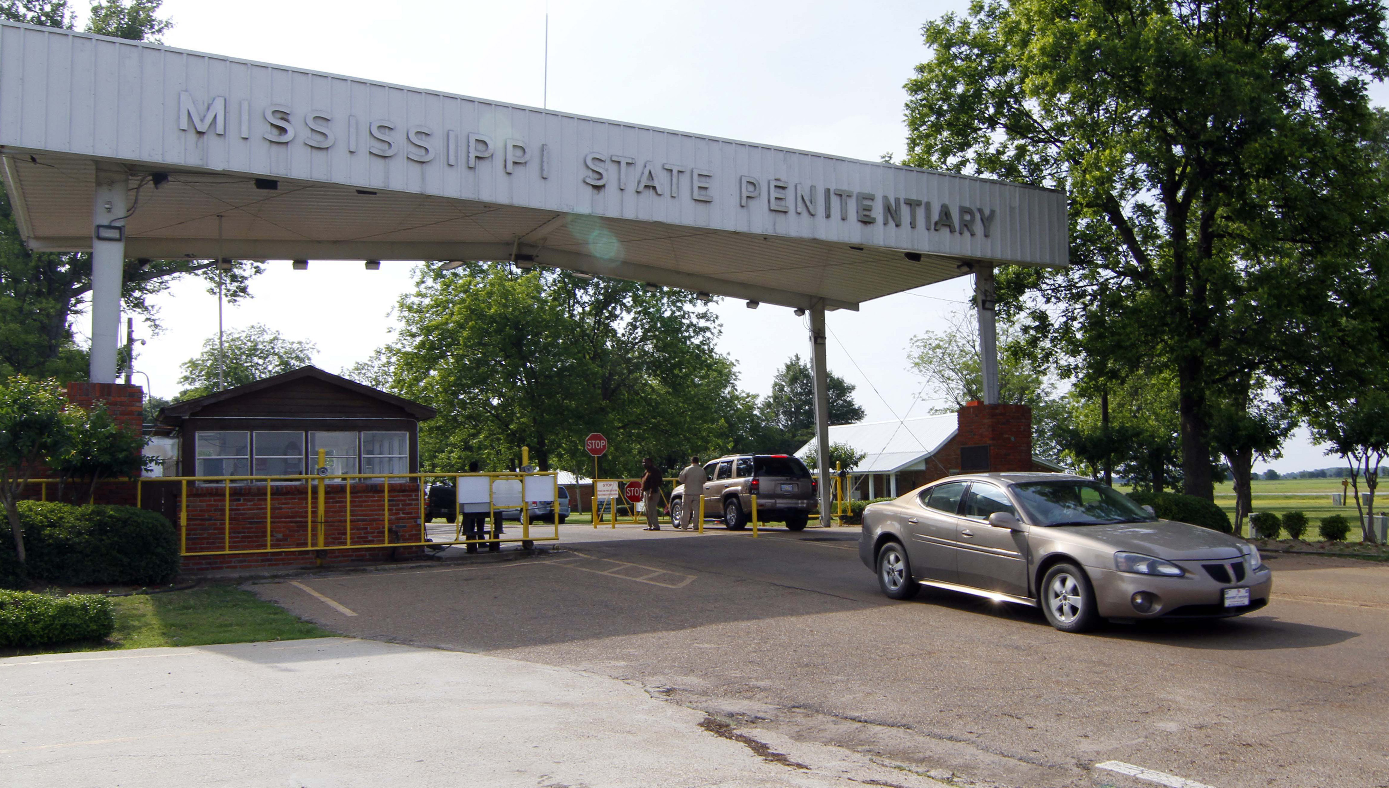 Traffic moves past the front of the Mississippi State Penitentiary in Parchman, Miss. on May 19, 2010. Another Mississippi inmate died at the hands of a fellow inmate on, Jan. 2, 2020, this time, at the penitentiary, bringing the death toll to four amid disturbances over the past week in the state prison system. (Rogelio V. Solis—AP)