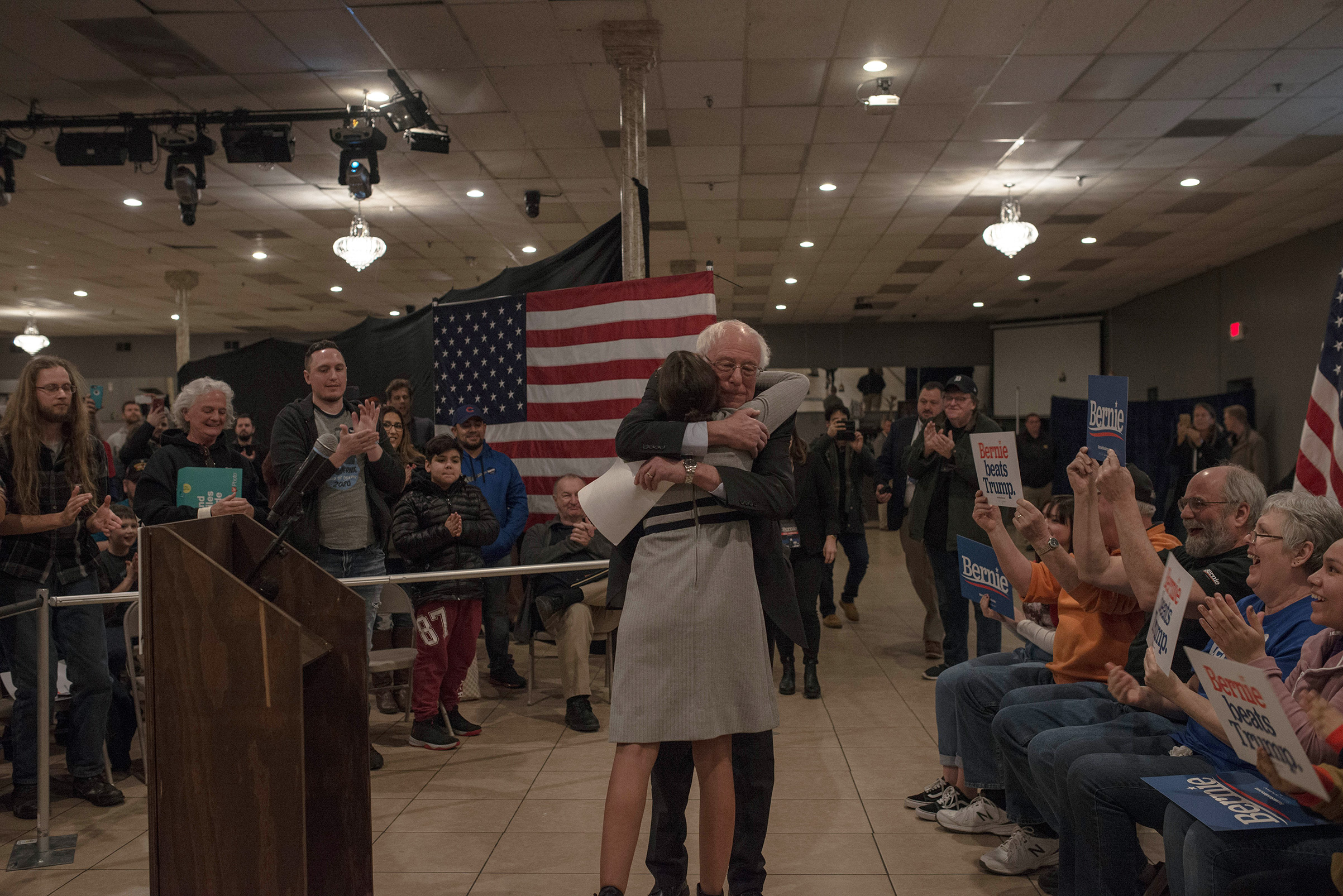Democratic presidential candidate Sen. Bernie Sanders hugs Rep. Alexandria Ocasio-Cortez at a town hall in Marshalltown, Iowa, Jan. 26, 2020. (September Dawn Bottoms for TIME)