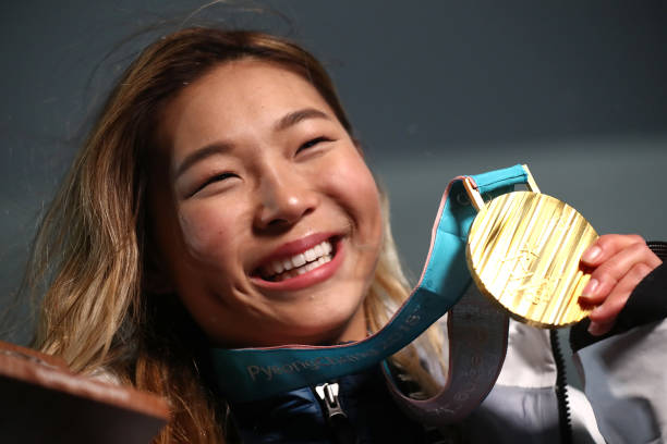 PYEONGCHANG-GUN, SOUTH KOREA - FEBRUARY 13:  Gold medalist Chloe Kim of the United States poses during the medal ceremony for the Snowboard Ladies' Halfpipe Final on day four of the PyeongChang 2018 Winter Olympic Games at Medal Plaza on February 13, 2018 in Pyeongchang-gun, South Korea.  (Photo by Alexander Hassenstein/Getty Images)