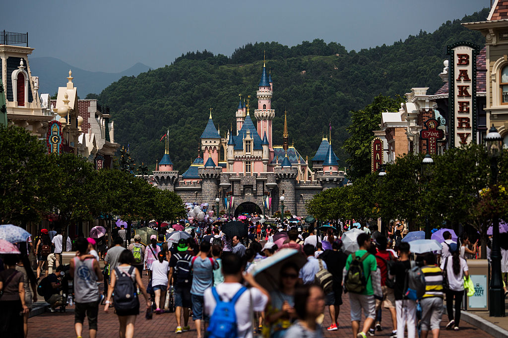 Hong Kong Disneyland, which opened in 2005, is the smallest Disney theme park. Hong Kong officials are asking the Disney to allow a tract of land earmarked for expansion to be used for transitional housing, instead. (Justin Chin—Bloomberg/Getty Images)