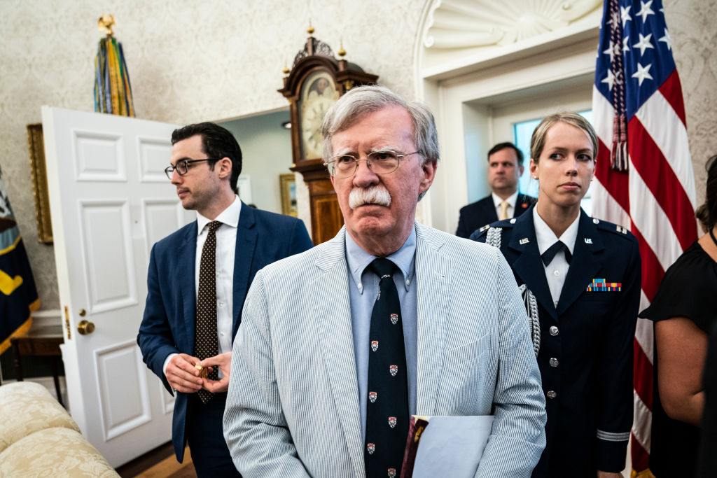 Then National Security Advisor John R. Bolton listens as President Donald J. Trump and First Lady Melania Trump meet with Buzz Aldrin, Michael Collins, and the Family of Neil Armstrong in celebration of the 50th anniversary of the Apollo 11 Moon landing at the White House in Washington, DC, on July 19th, 2019. (Jabin Botsford—The Washington Post/Getty Images)